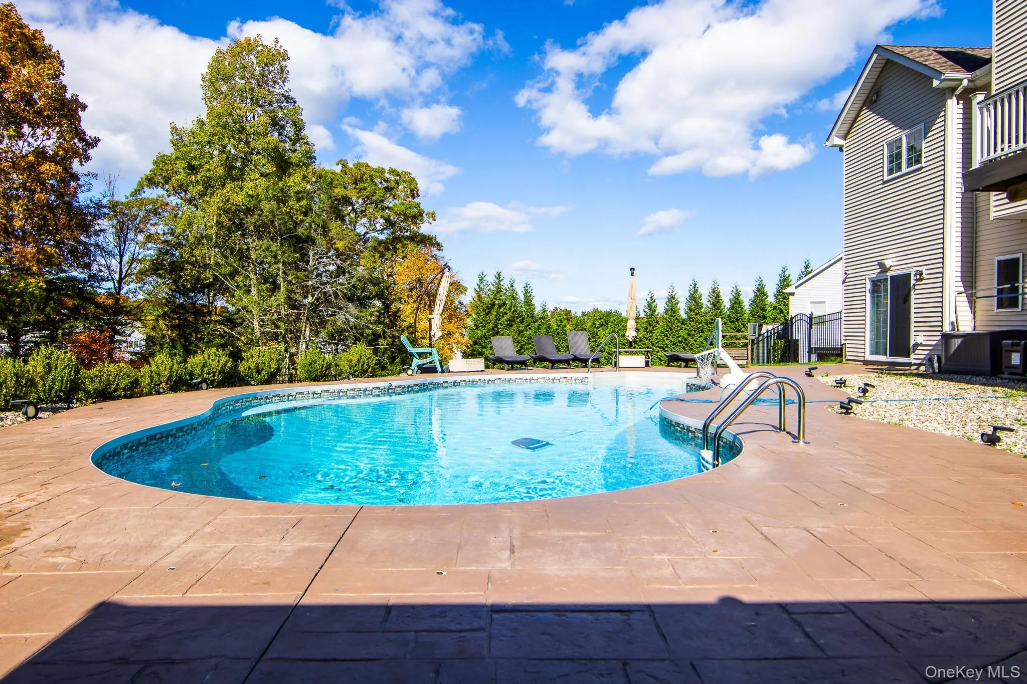 Swimming pool with a patio area Swimming pool with a patio area