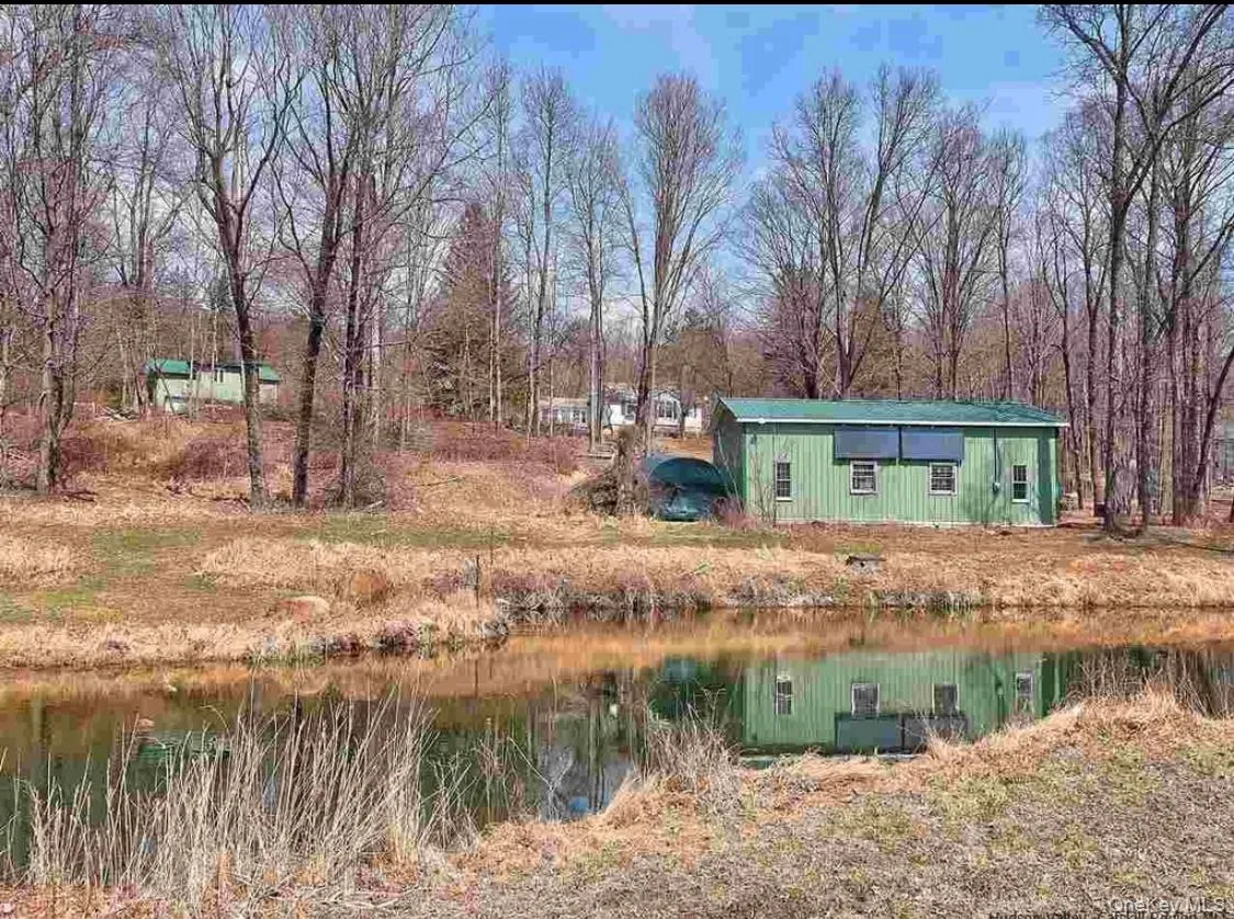 View of yard featuring a water view View of yard featuring a water view