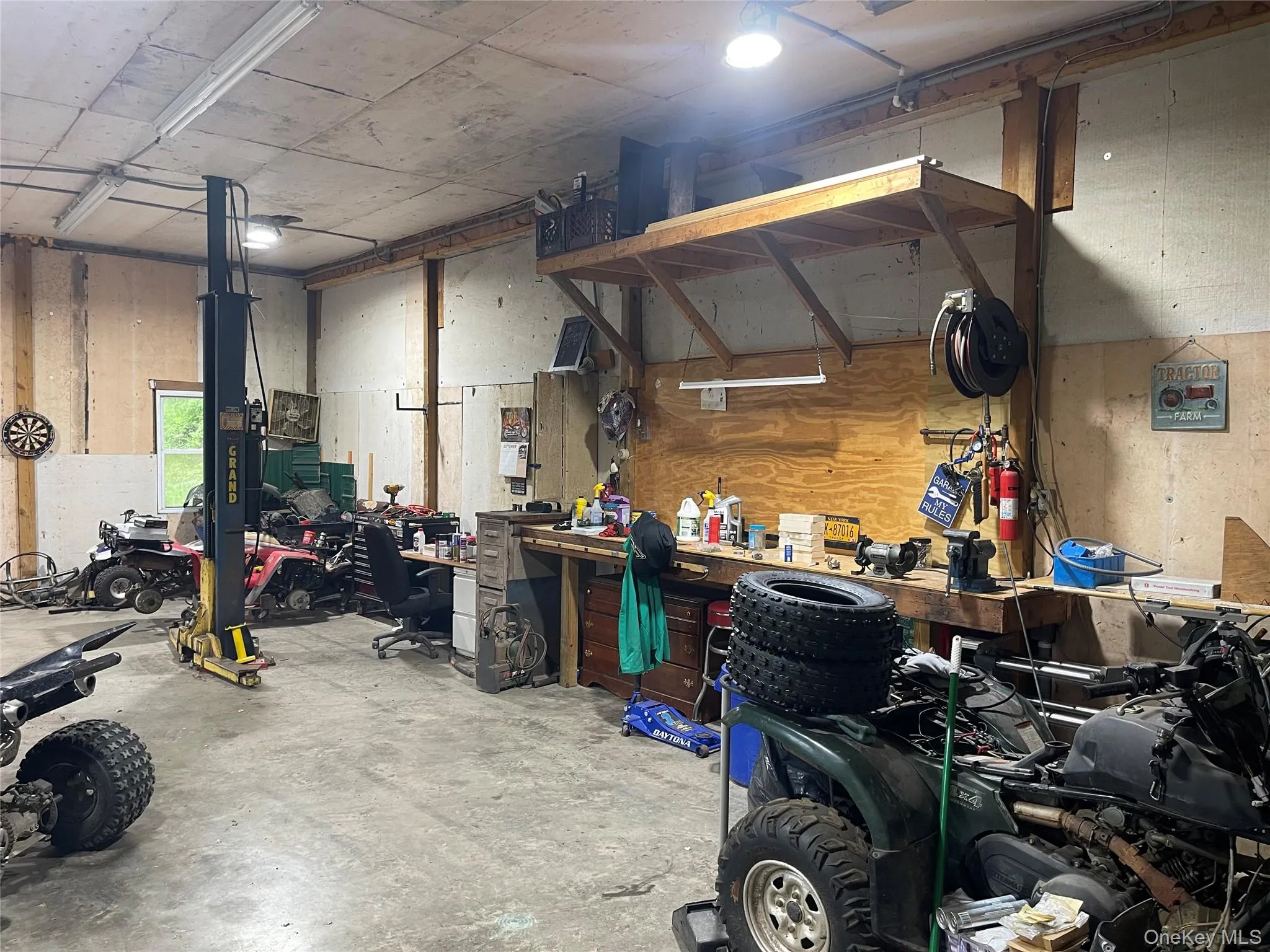 Garage featuring a workshop area Garage featuring a workshop area