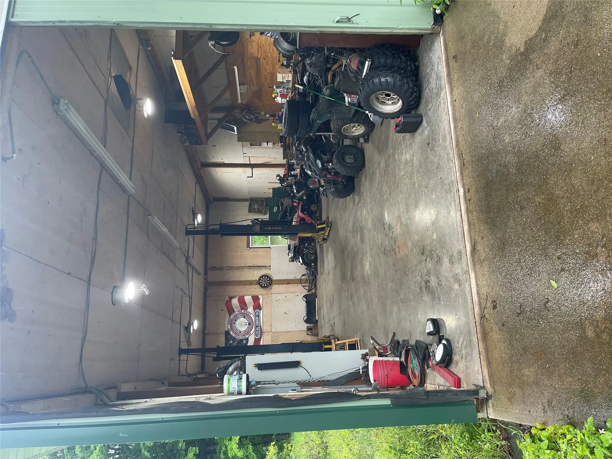 Garage featuring a workshop area Garage featuring a workshop area