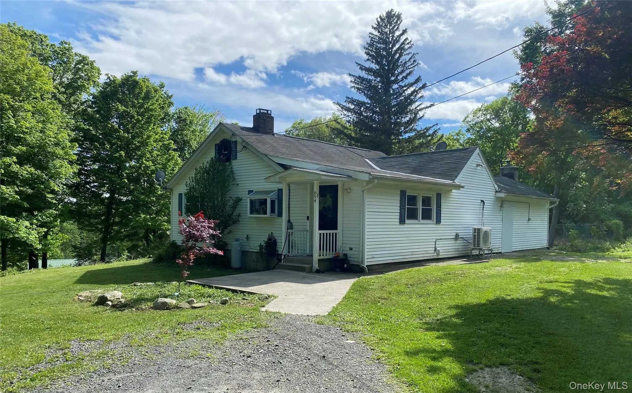 View of front of house with a chimney, a front yard, and roof with shingles View of front of house with a chimney, a front yard, and roof with shingles
