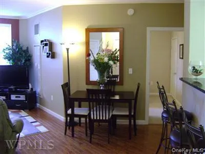 Wood floors extend into the living room. Plenty space for living and entertaining. Wood floors extend into the living room. Plenty space for living and entertaining.