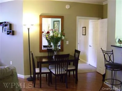 Dining area is adjacent to the kitchen and living rooms. Wood floors adorn this space. Dining area is adjacent to the kitchen and living rooms. Wood floors adorn this space.