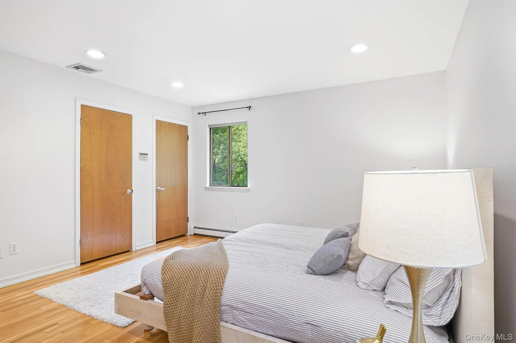 The primary bedroom includes two closets The primary bedroom includes two closets