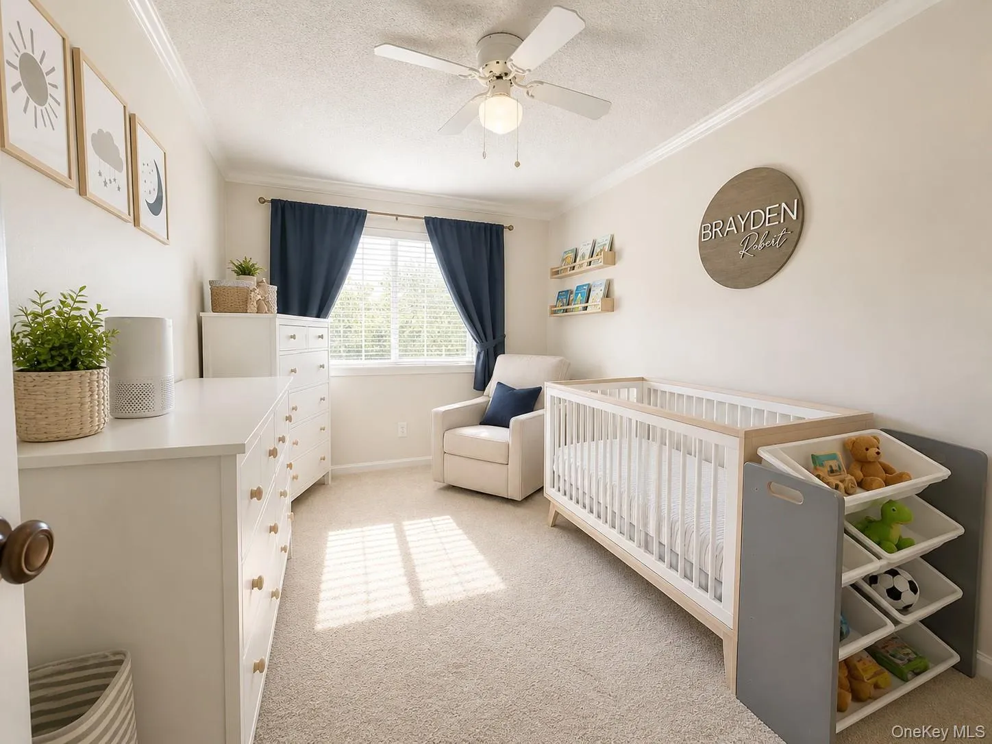 Carpeted room featuring a ceiling fan, crown molding, and natural light from a window with blinds Carpeted room featuring a ceiling fan, crown molding, and natural light from a window with blinds