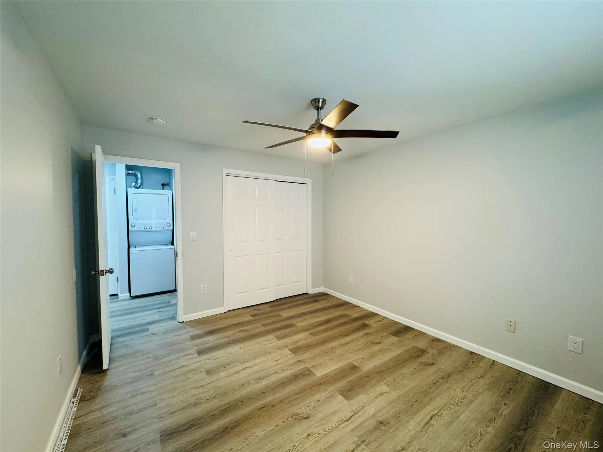 1st Bedroom with large closet, light/fan and vinyl flooring. 1st Bedroom with large closet, light/fan and vinyl flooring.