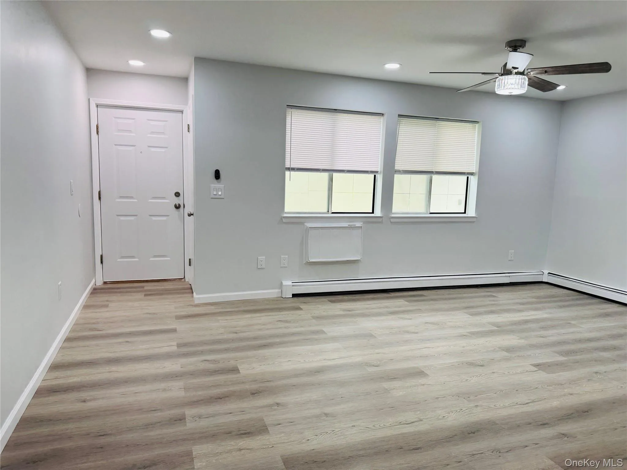 Newly painted Living Room with vinyl flooring. Newly painted Living Room with vinyl flooring.