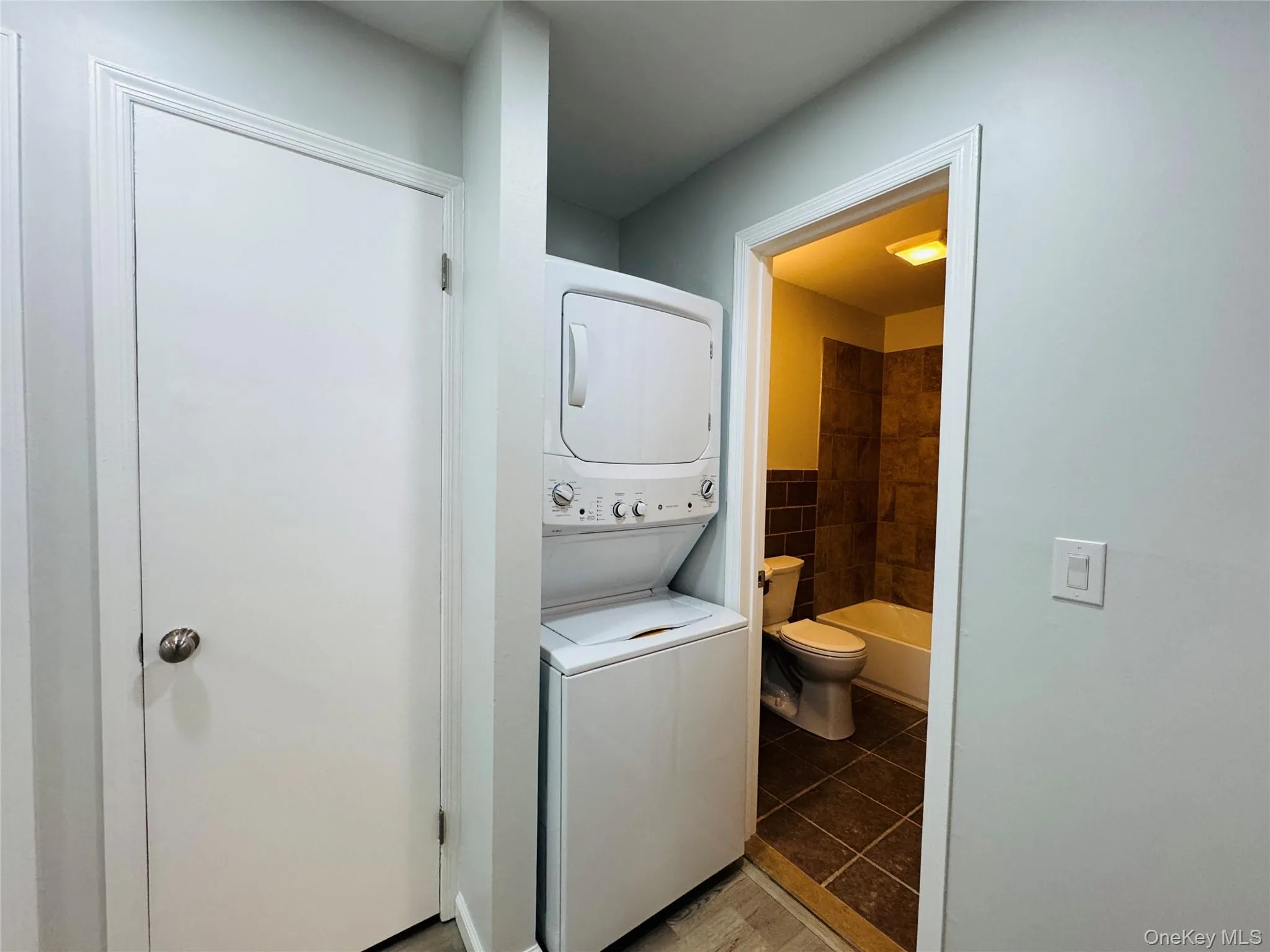 Hall closet and stackable washer/dryer. Hall closet and stackable washer/dryer.