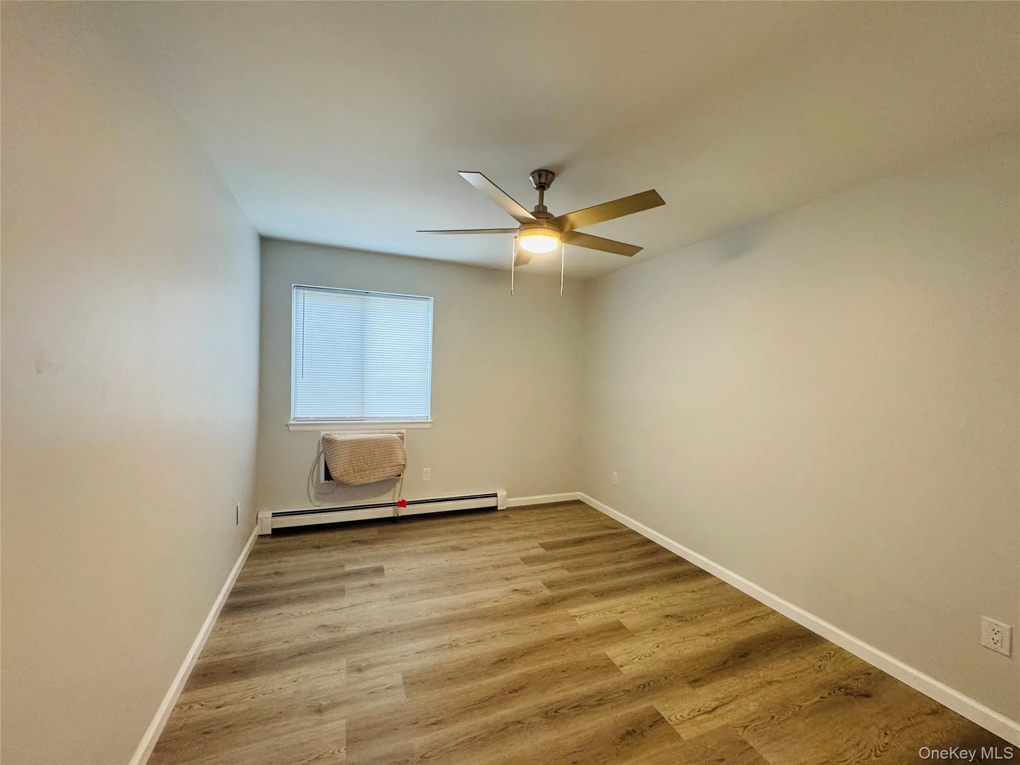 2nd Bedroom with light/fan, vinyl flooring, blinds and air conditioner. 2nd Bedroom with light/fan, vinyl flooring, blinds and air conditioner.