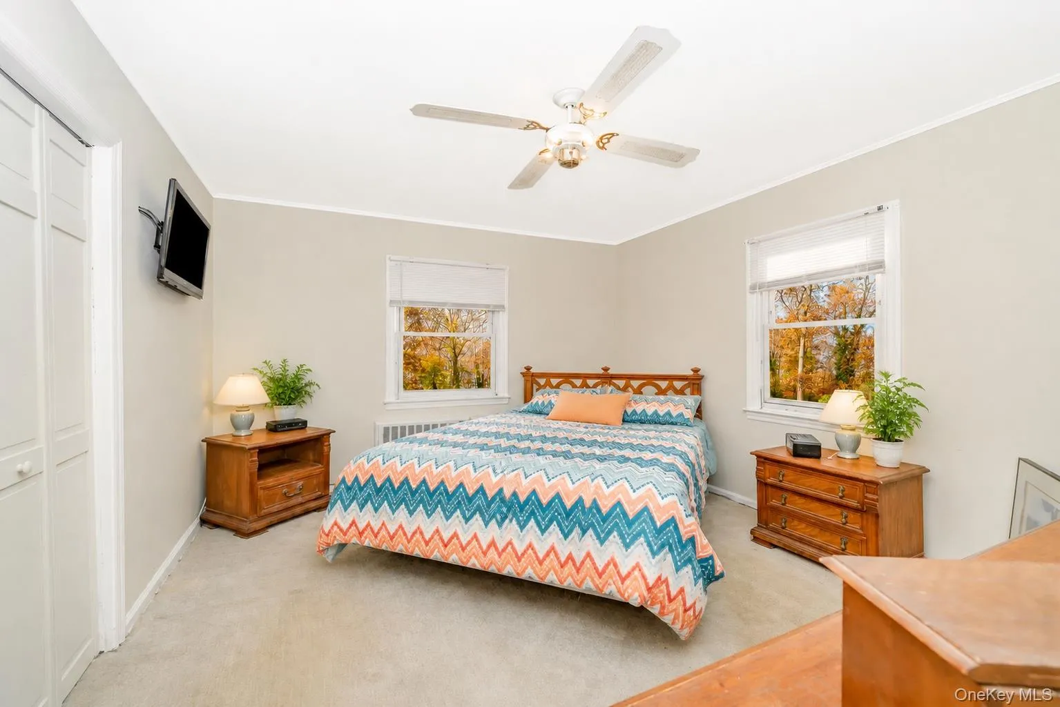 Virtually decorated primary bedroom with a bright feel Virtually decorated primary bedroom with a bright feel