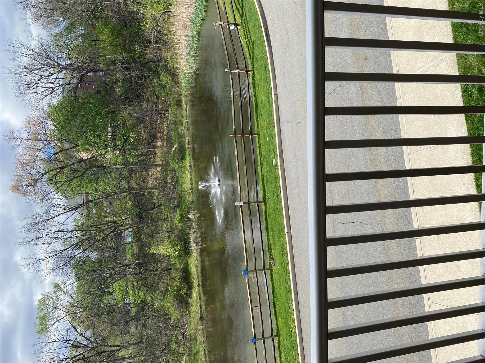 Deck overlooking pond with fountain Deck overlooking pond with fountain