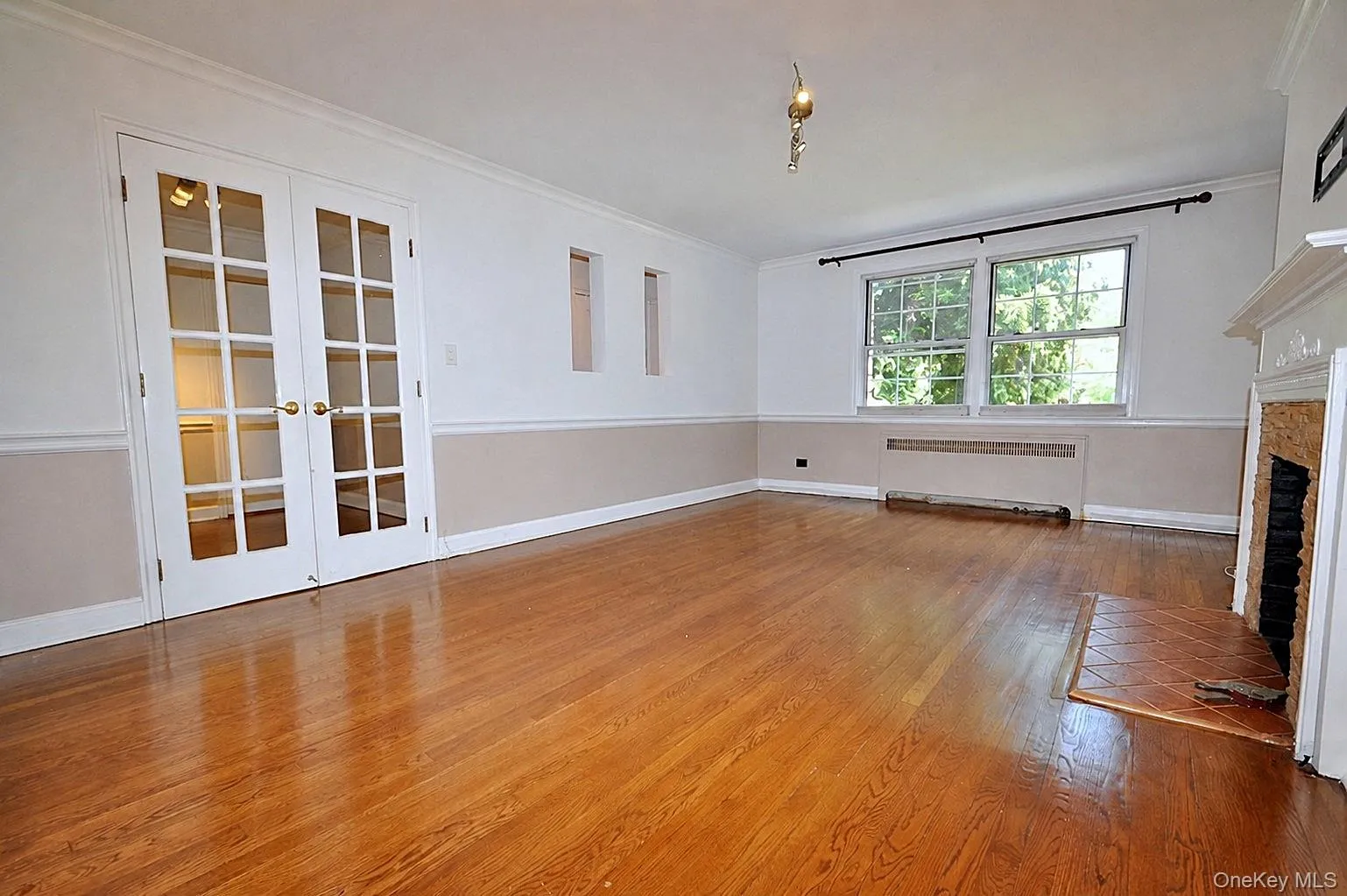 Living Room : French doors are off open den area at end of long entry hall brings you to this bright spacious Living room Living Room : French doors are off open den area at end of long entry hall brings you to this bright spacious Living room