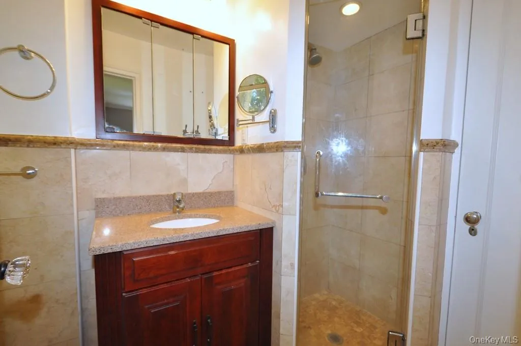 Ensuite Bathroom in primary bedroom w walk in glass shower & linen closet Ensuite Bathroom in primary bedroom w walk in glass shower & linen closet