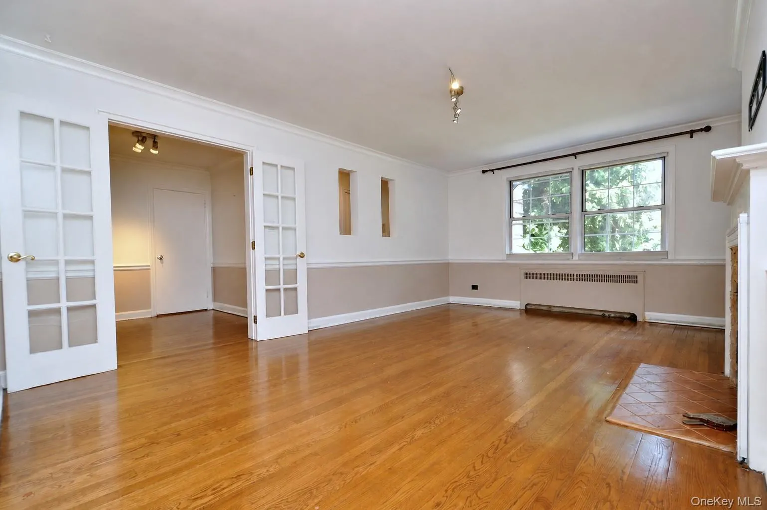 Living Room : French doors are off open den area at end of long entry hall brings you to this bright spacious Living room Living Room : French doors are off open den area at end of long entry hall brings you to this bright spacious Living room