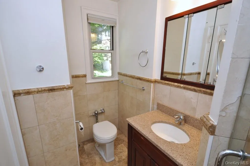 En suite Bathroom: Gutted and totally remodeled. Note a window here as well. Step in glass shower & linen closet En suite Bathroom: Gutted and totally remodeled. Note a window here as well. Step in glass shower & linen closet
