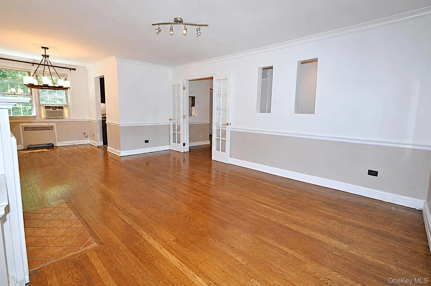 Living Room : French doors are off open den area at end of long entry hall brings you to this bright spacious Living room Living Room : French doors are off open den area at end of long entry hall brings you to this bright spacious Living room