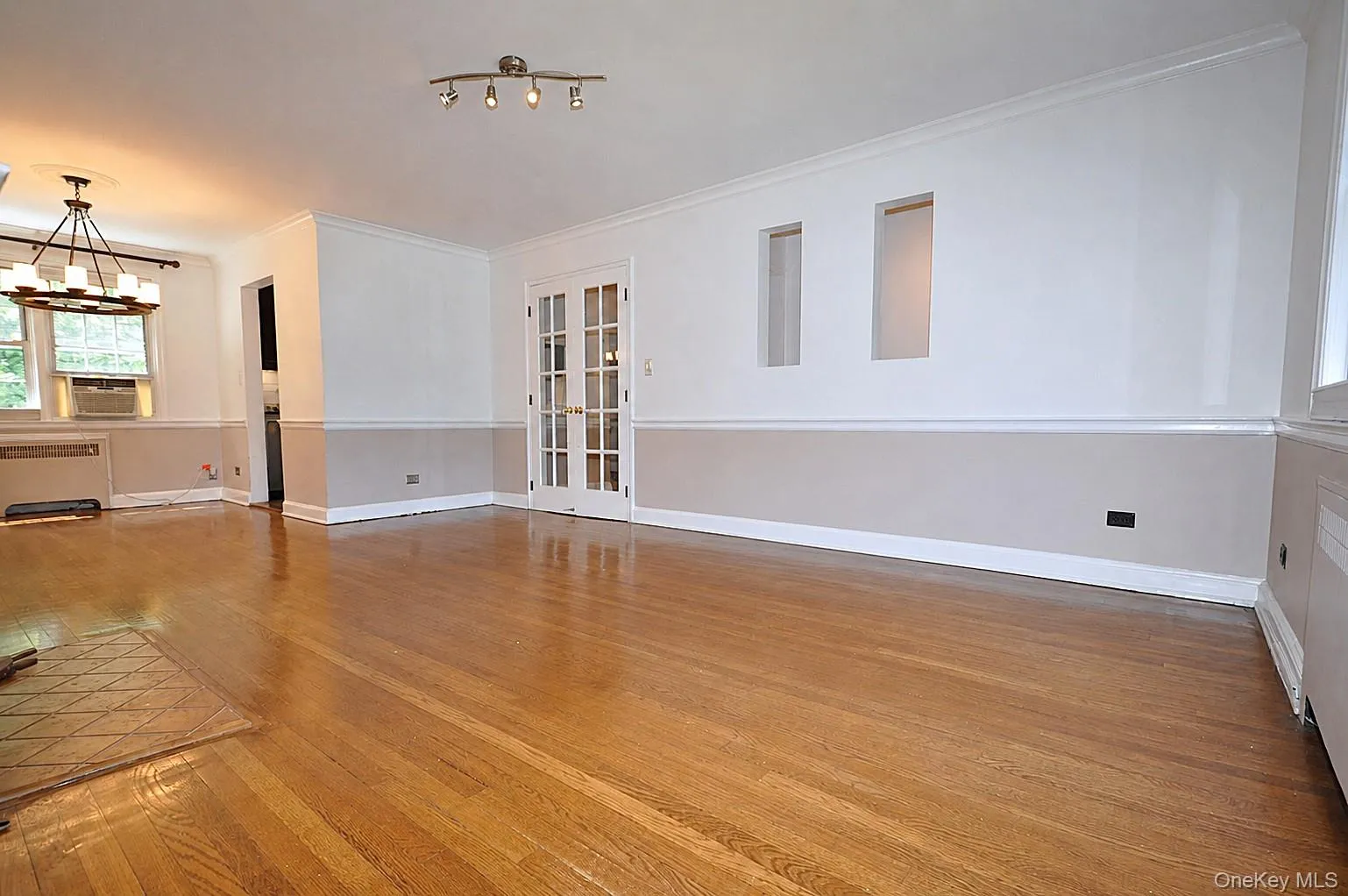 Living Room : French doors are off open den area at end of long entry hall brings you to this bright spacious Living room Living Room : French doors are off open den area at end of long entry hall brings you to this bright spacious Living room
