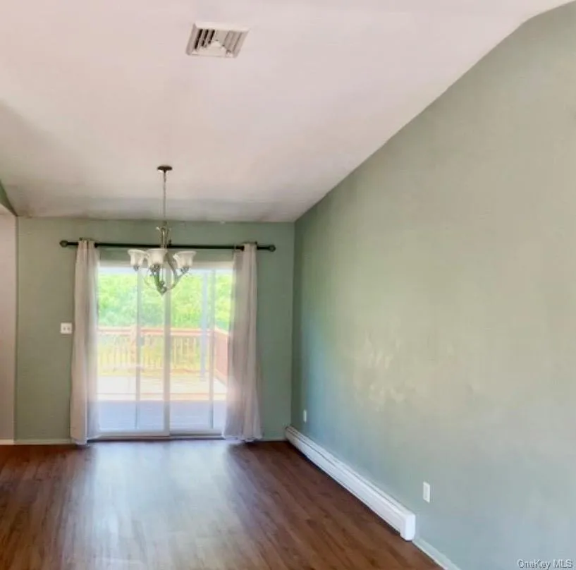Open Dining Area with glass sliding doors to deck and backyard. Open Dining Area with glass sliding doors to deck and backyard.