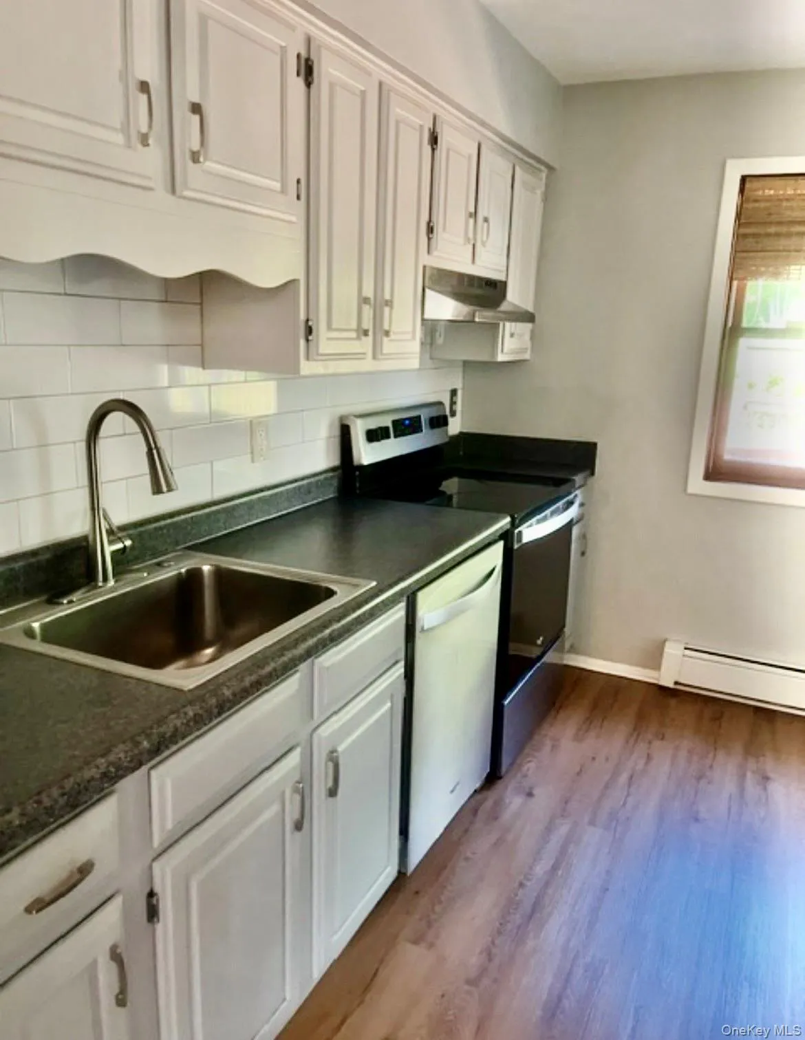 Updated kitchen with stainless steel Dishwasher and fridge Updated kitchen with stainless steel Dishwasher and fridge