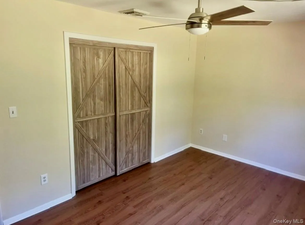 Spacious bedroom with barn door closet Spacious bedroom with barn door closet