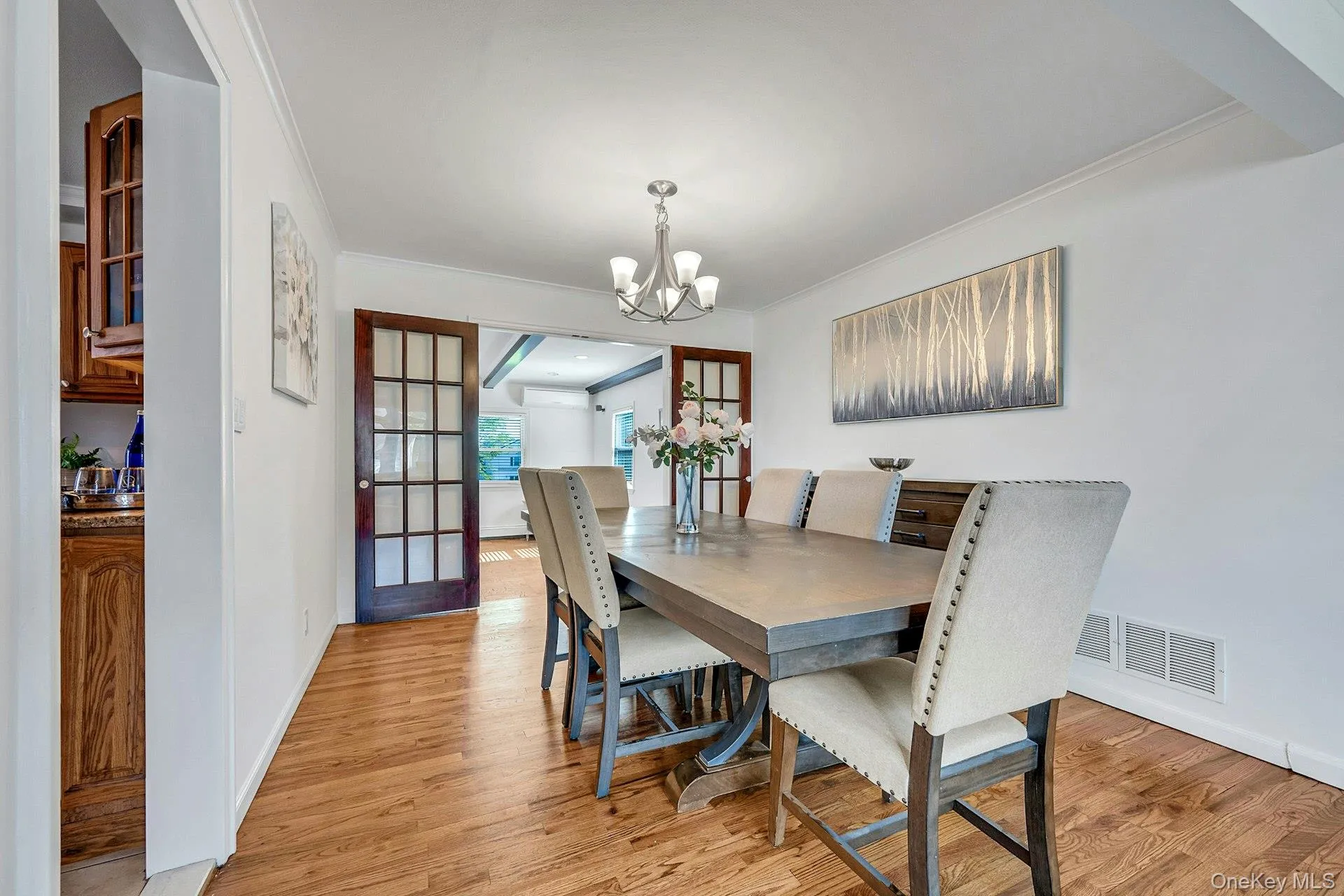 Dining room opening to large family room through french doors Dining room opening to large family room through french doors