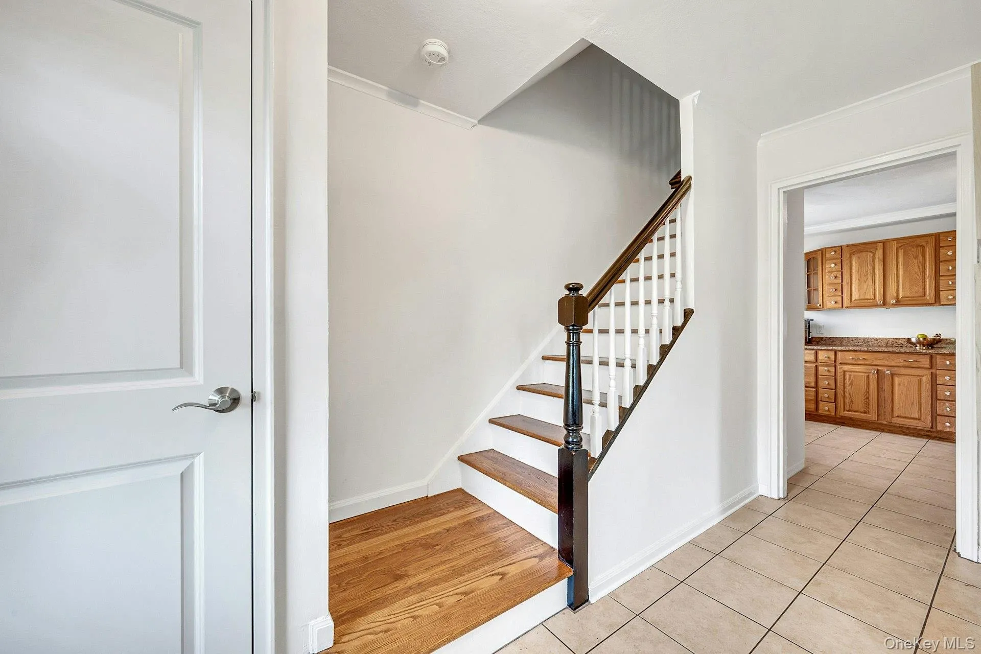 Entry hall showing coat closet and stairs Entry hall showing coat closet and stairs