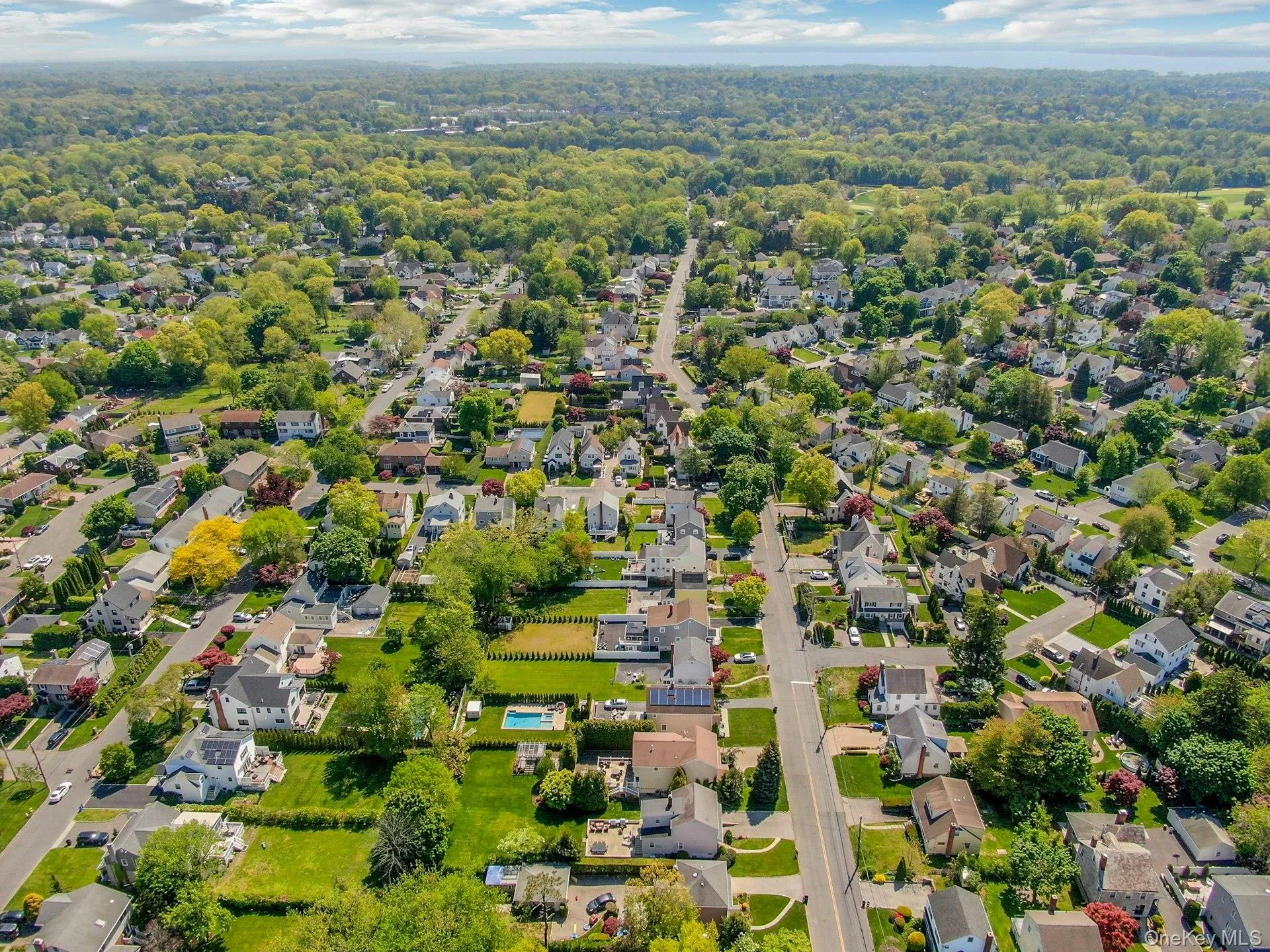 Aerial view of neighborhood. Twin Lakes nature preserve in distance Aerial view of neighborhood. Twin Lakes nature preserve in distance
