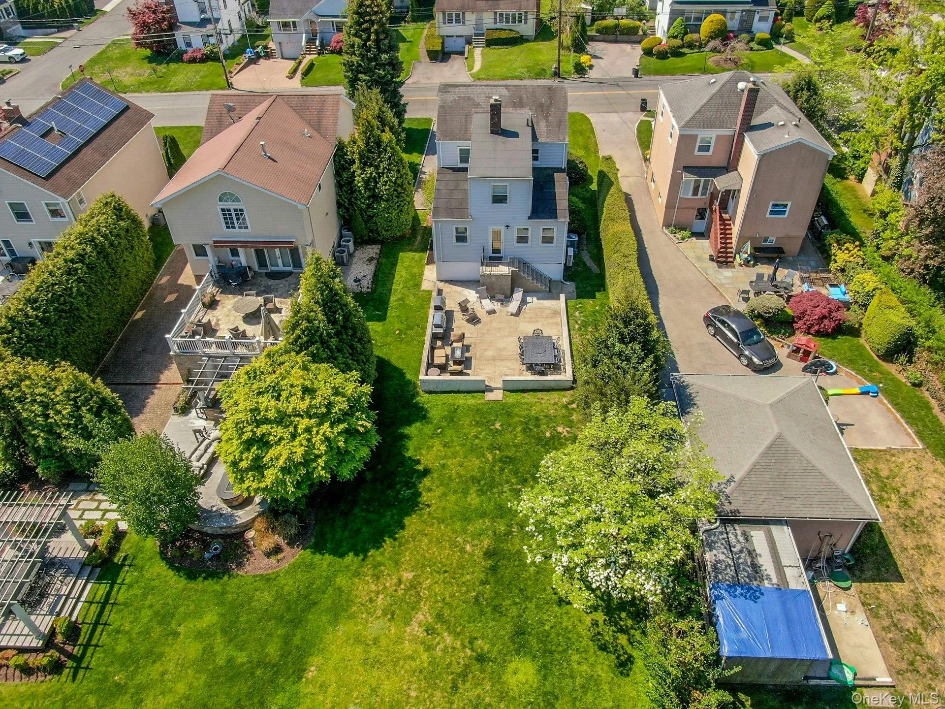 Aerial view showing back of home, patio and yard Aerial view showing back of home, patio and yard