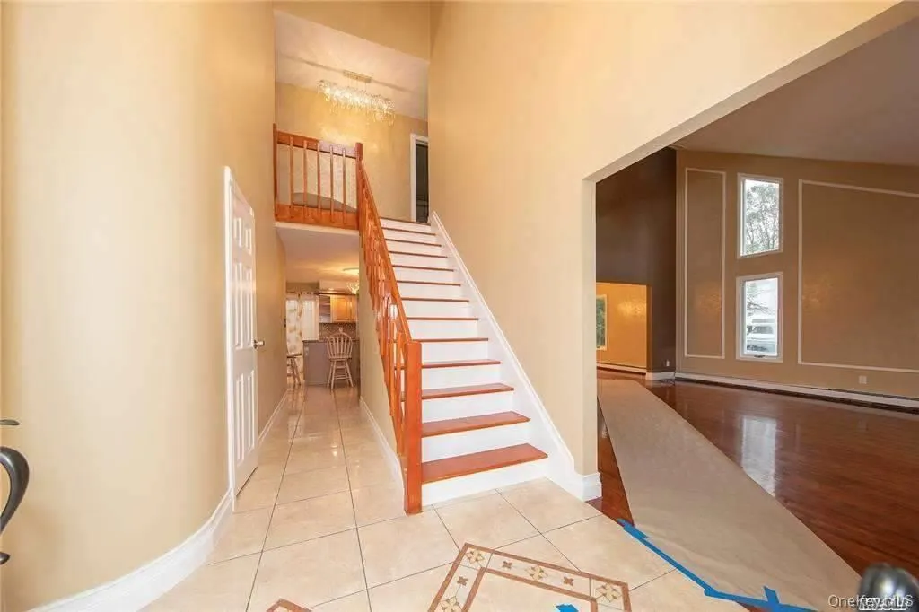 Grand entry leading to Living room, back of the house or the upstairs where the 4 Bedrooms and 2 full bathrooms are located. Grand entry leading to Living room, back of the house or the upstairs where the 4 Bedrooms and 2 full bathrooms are located.