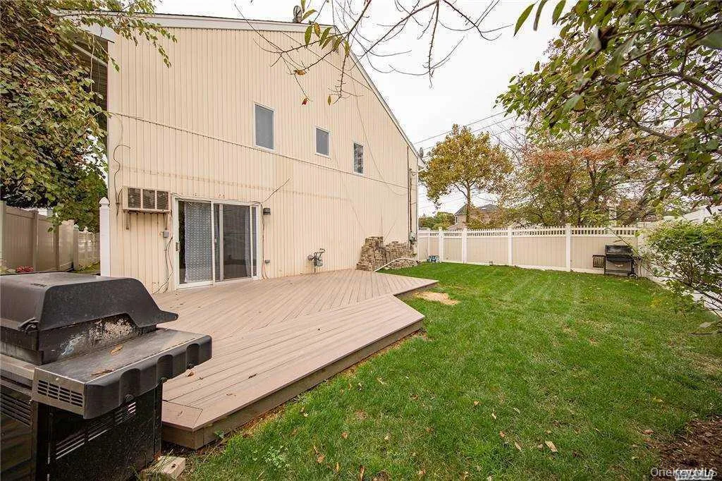 Patio and yard, fenced. Sliders leading from Den to patio. Patio and yard, fenced. Sliders leading from Den to patio.