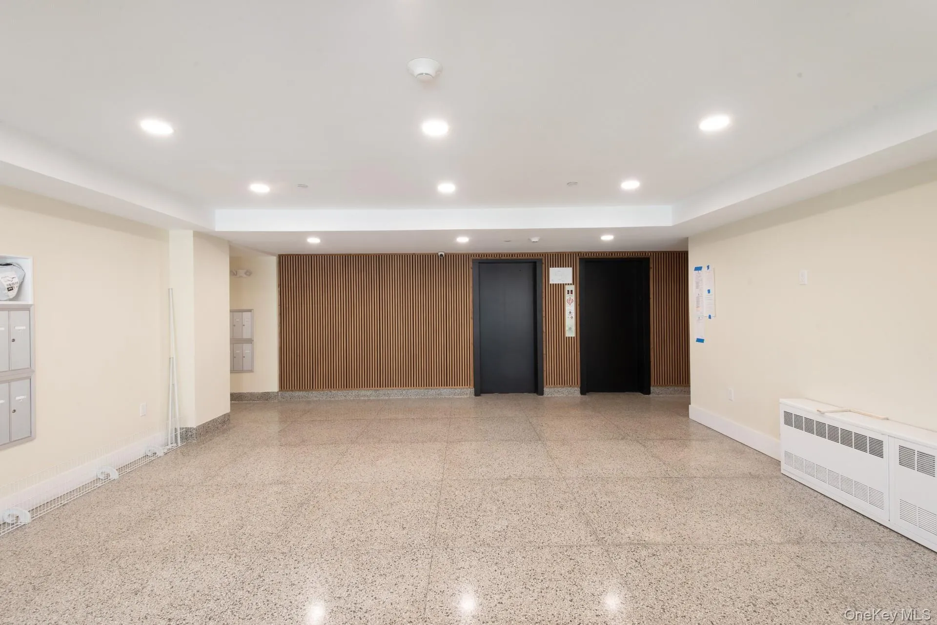Updated lobby with two elevators (note: lobby entrance and parking areas under construction) Updated lobby with two elevators (note: lobby entrance and parking areas under construction)