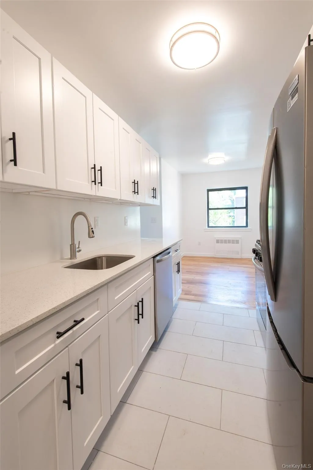 Kitchen leads to dining area with window Kitchen leads to dining area with window