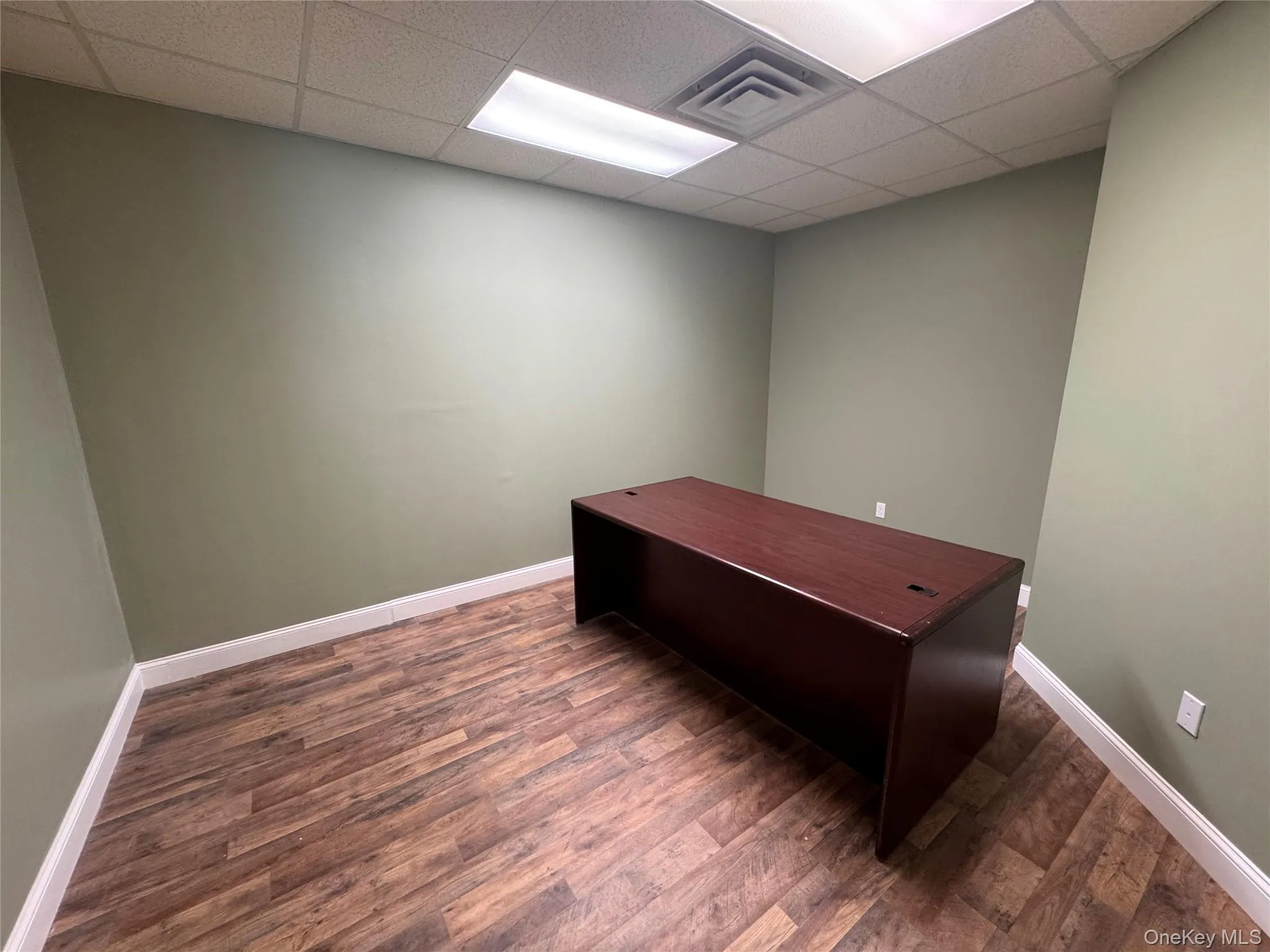 Wood-finish flooring with white trim Wood-finish flooring with white trim