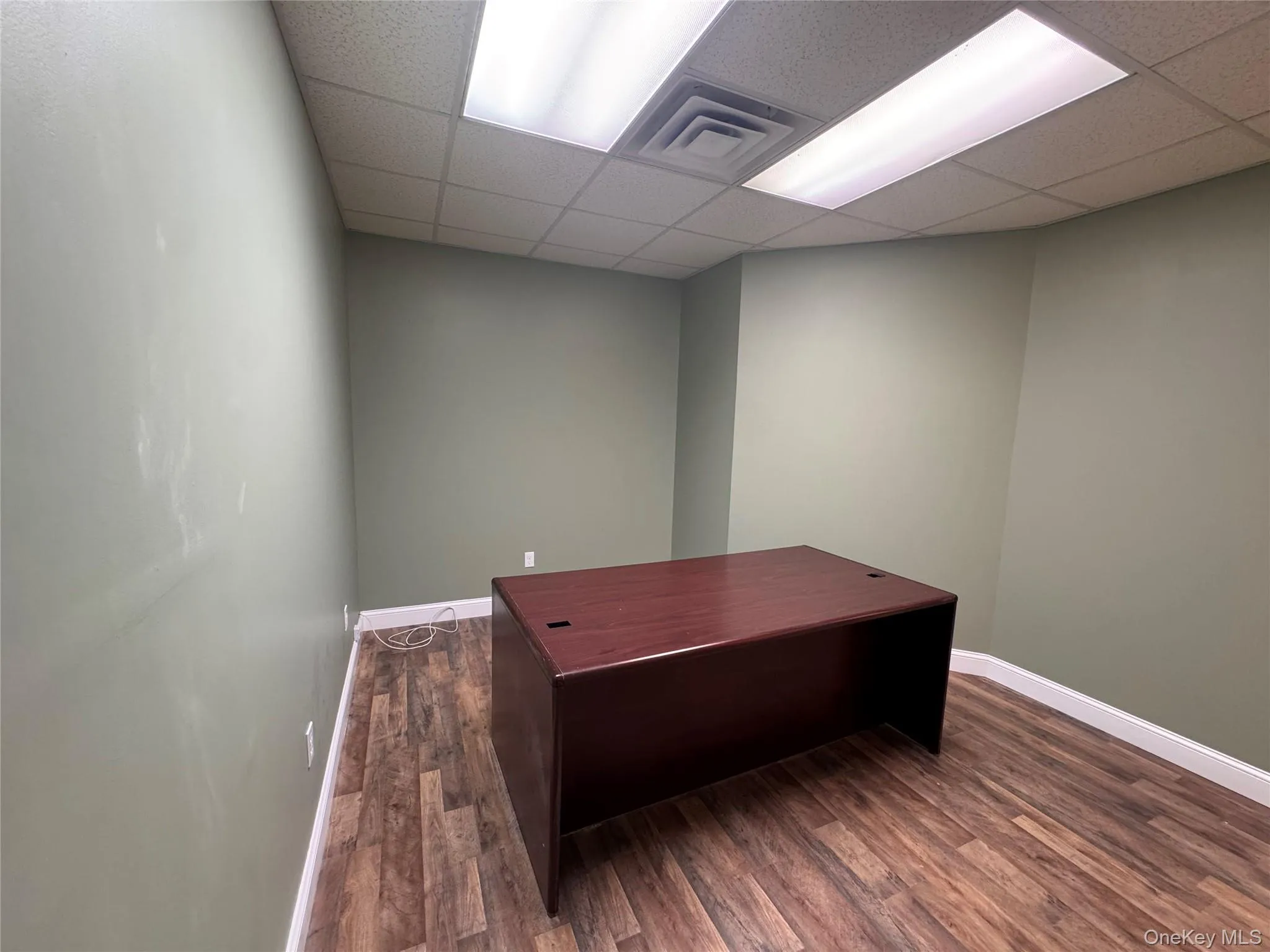 Wood-finish flooring, drop ceiling, and recessed lighting Wood-finish flooring, drop ceiling, and recessed lighting