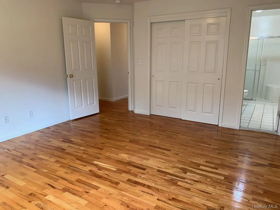 The spacious primary bedroom suite features a private shower stall bathroom and an oversized double closet The spacious primary bedroom suite features a private shower stall bathroom and an oversized double closet
