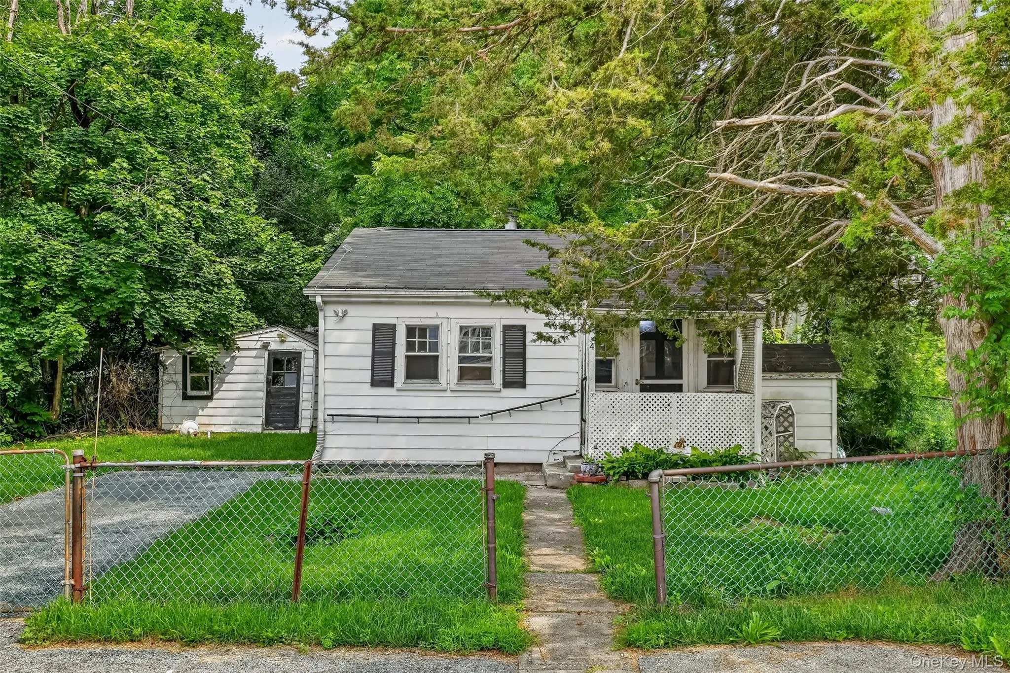 Front of home with enclosed fence Front of home with enclosed fence