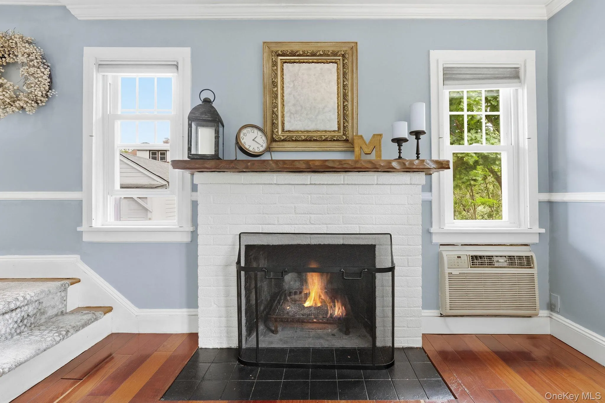 Whether relaxing by the fireplace or enjoying the sunshine streaming through the windows, this living room is designed for everyday comfort. Whether relaxing by the fireplace or enjoying the sunshine streaming through the windows, this living room is designed for everyday comfort.