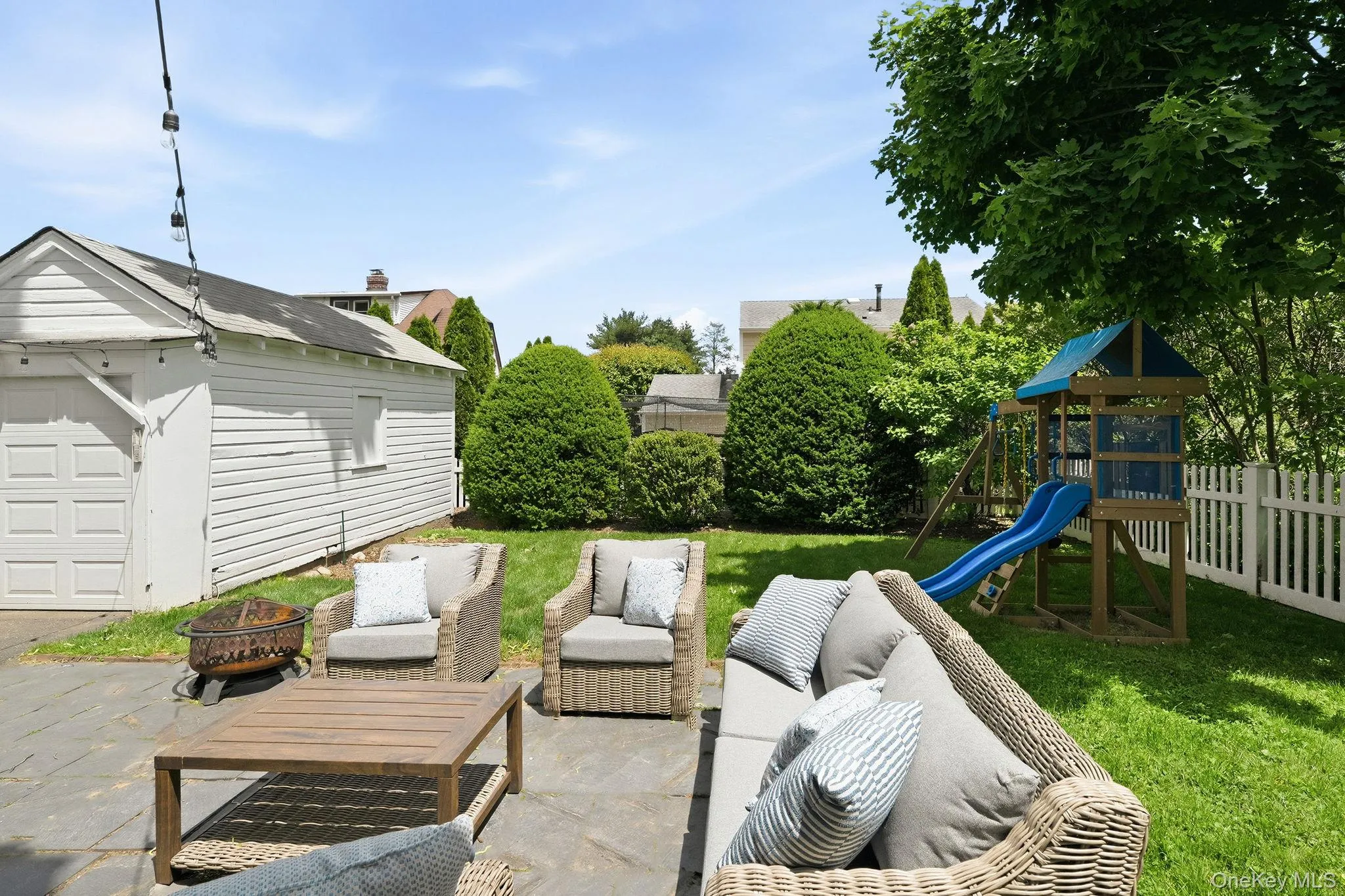 From summer barbecues on the patio to afternoons in the play area, this backyard is made for making memories. From summer barbecues on the patio to afternoons in the play area, this backyard is made for making memories.