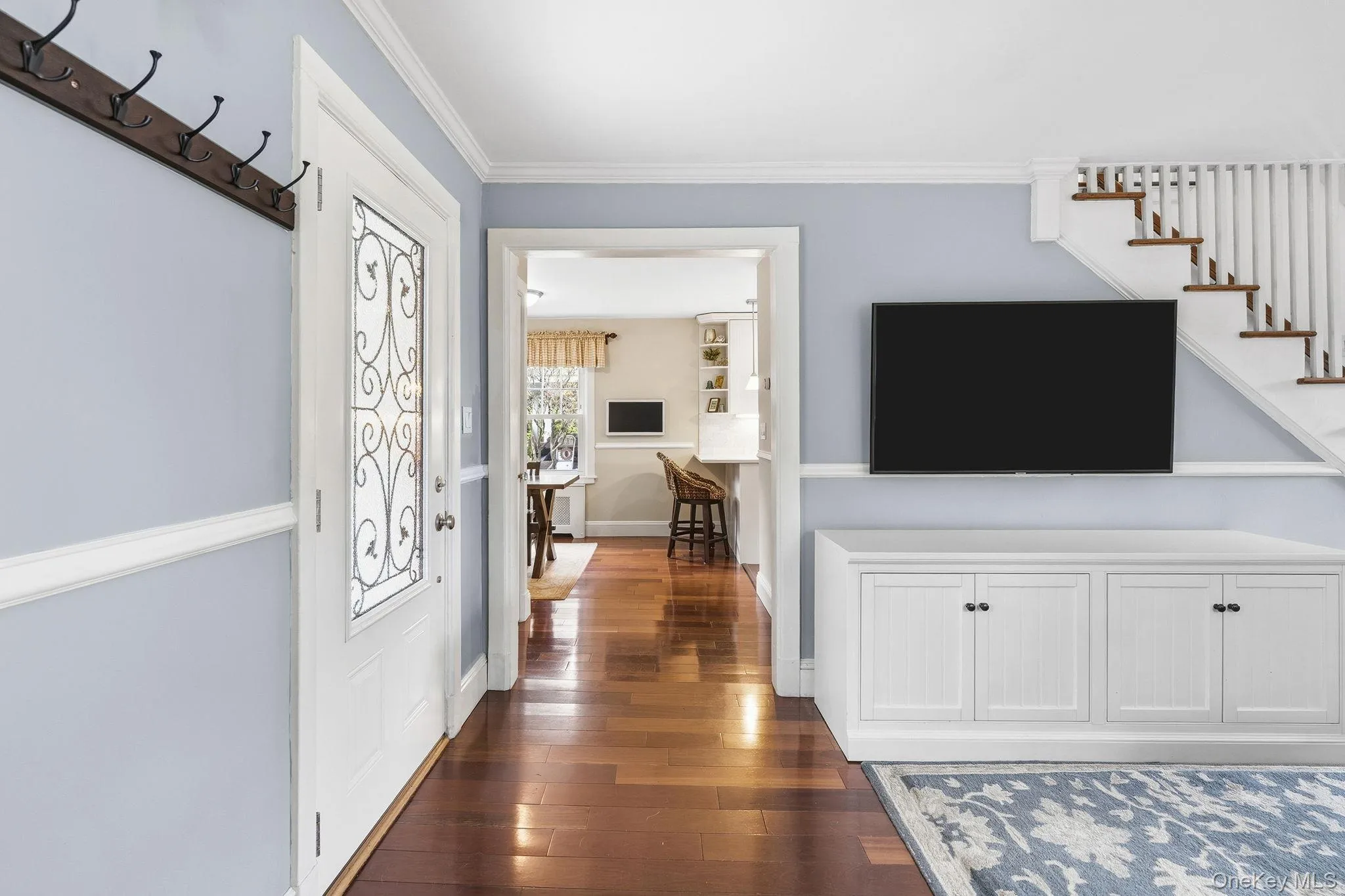 Vibrant and welcoming, the entry foyer showcases rich Brazilian Cherry hardwood flooring that sets the stage for the exceptional spaces beyond. Vibrant and welcoming, the entry foyer showcases rich Brazilian Cherry hardwood flooring that sets the stage for the exceptional spaces beyond.