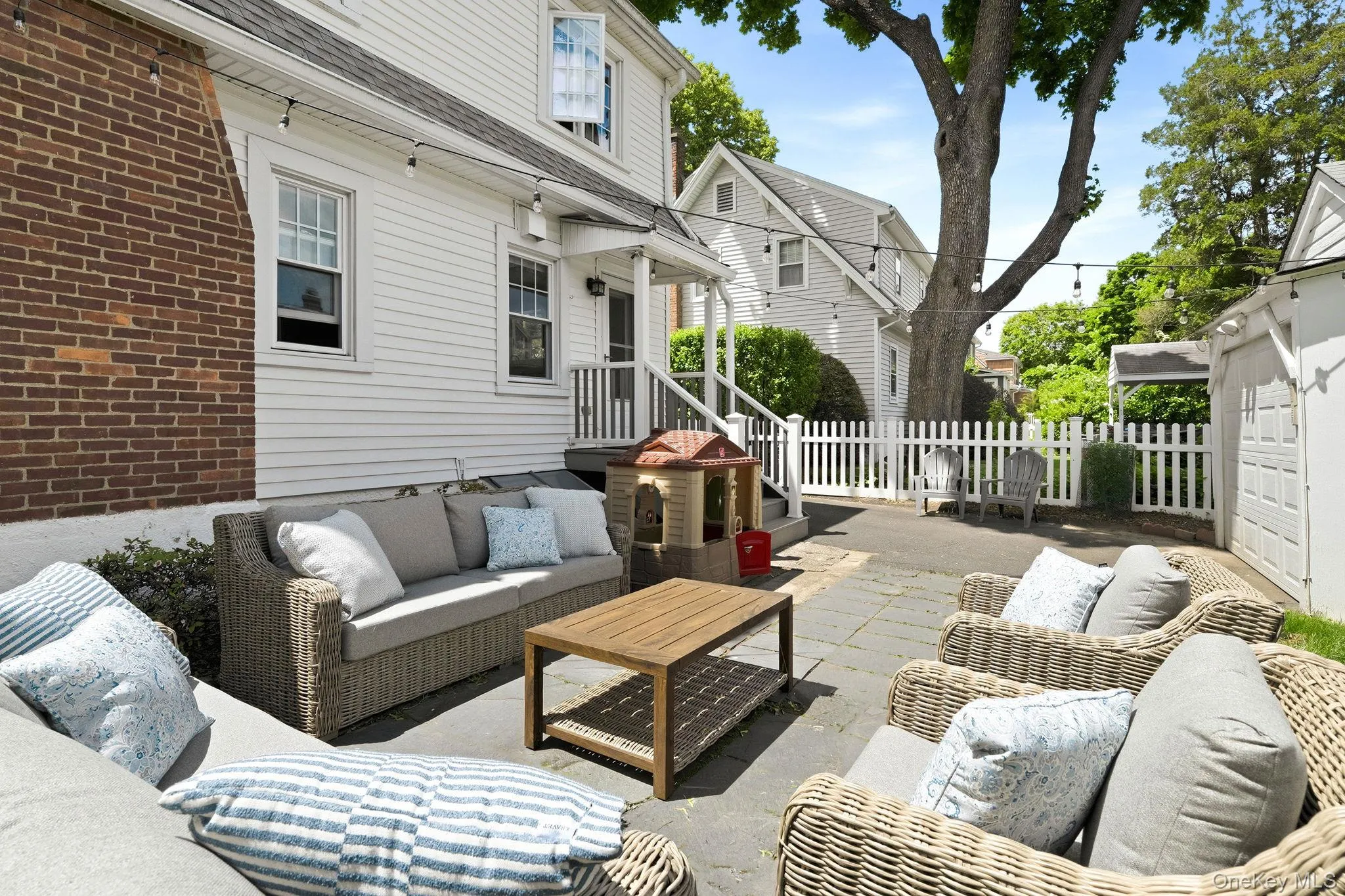 A private outdoor oasis featuring multiple spaces for entertaining, gathering, and enjoying the outdoors. A private outdoor oasis featuring multiple spaces for entertaining, gathering, and enjoying the outdoors.