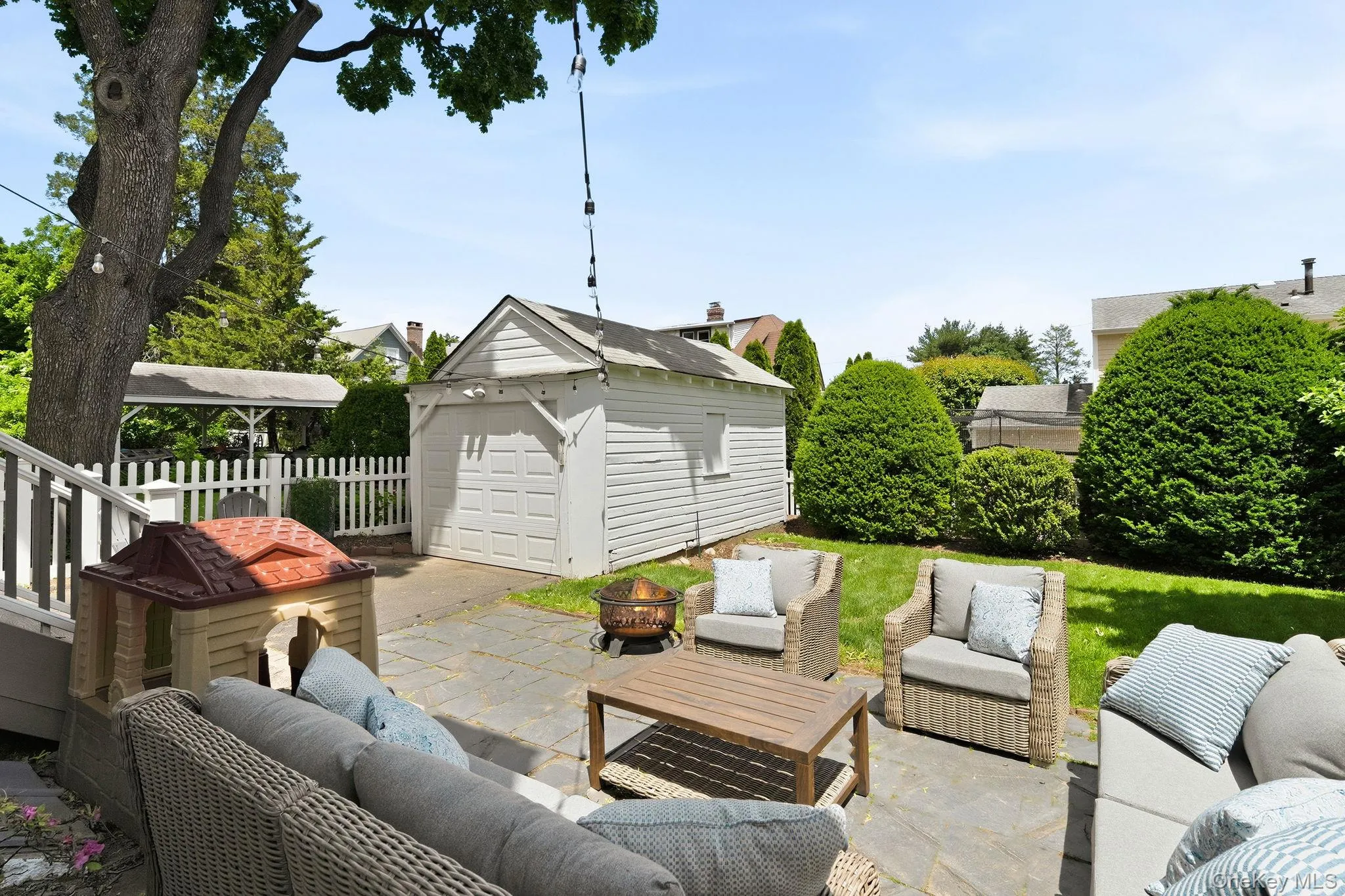 Surrounded by privacy, the beautifully designed backyard features a spacious patio and dedicated play area, creating the ultimate outdoor sanctuary. Surrounded by privacy, the beautifully designed backyard features a spacious patio and dedicated play area, creating the ultimate outdoor sanctuary.