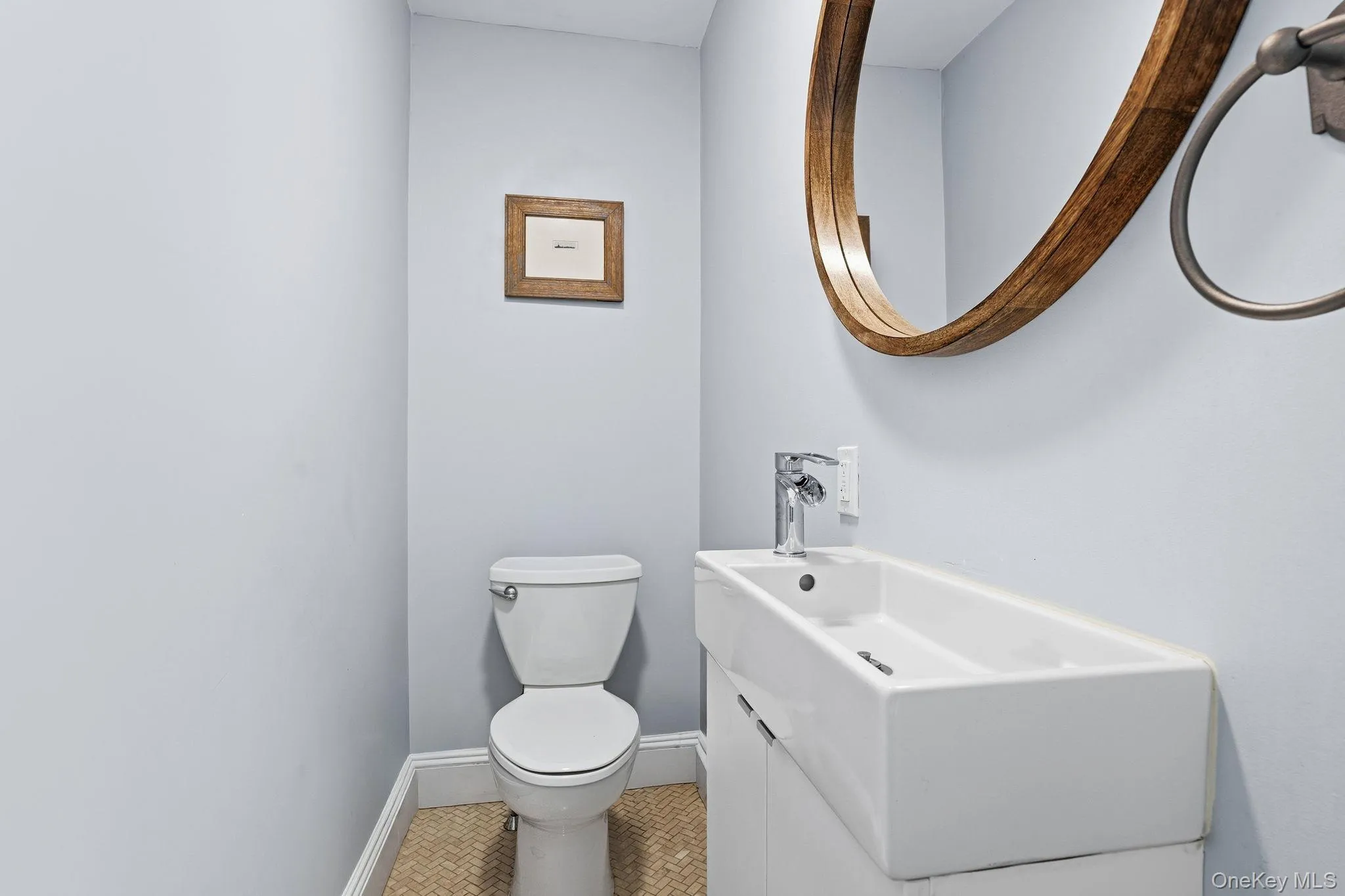 Conveniently located on the main level, the powder room combines style and functionality. Conveniently located on the main level, the powder room combines style and functionality.