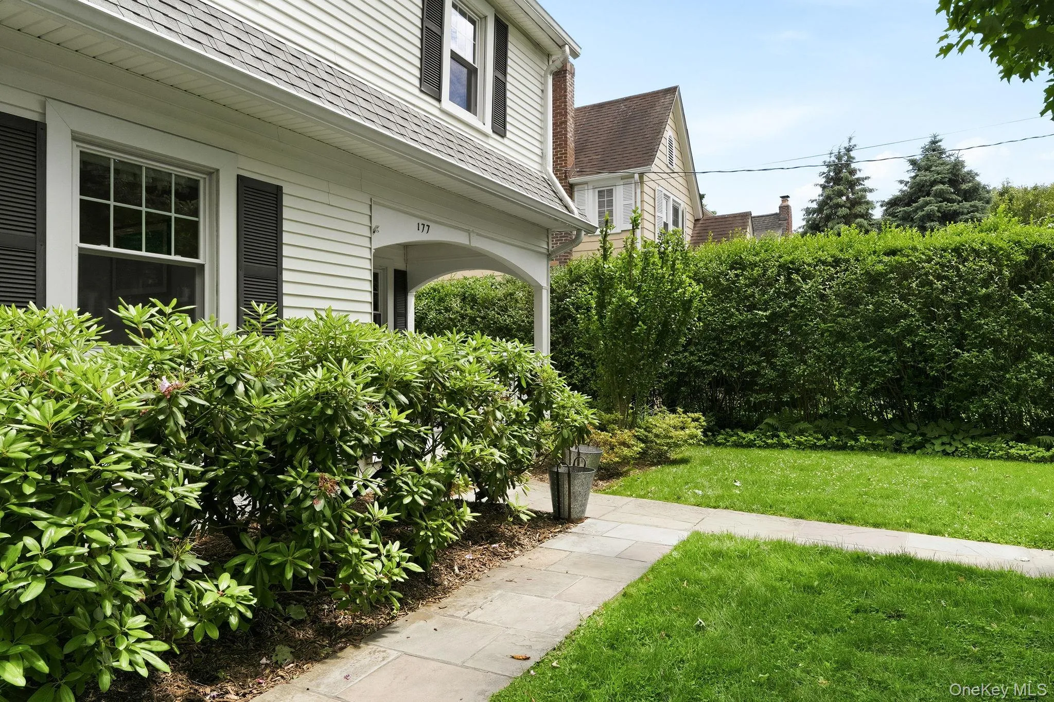 A garden-lined walkway offers a warm and inviting arrival experience. A garden-lined walkway offers a warm and inviting arrival experience.