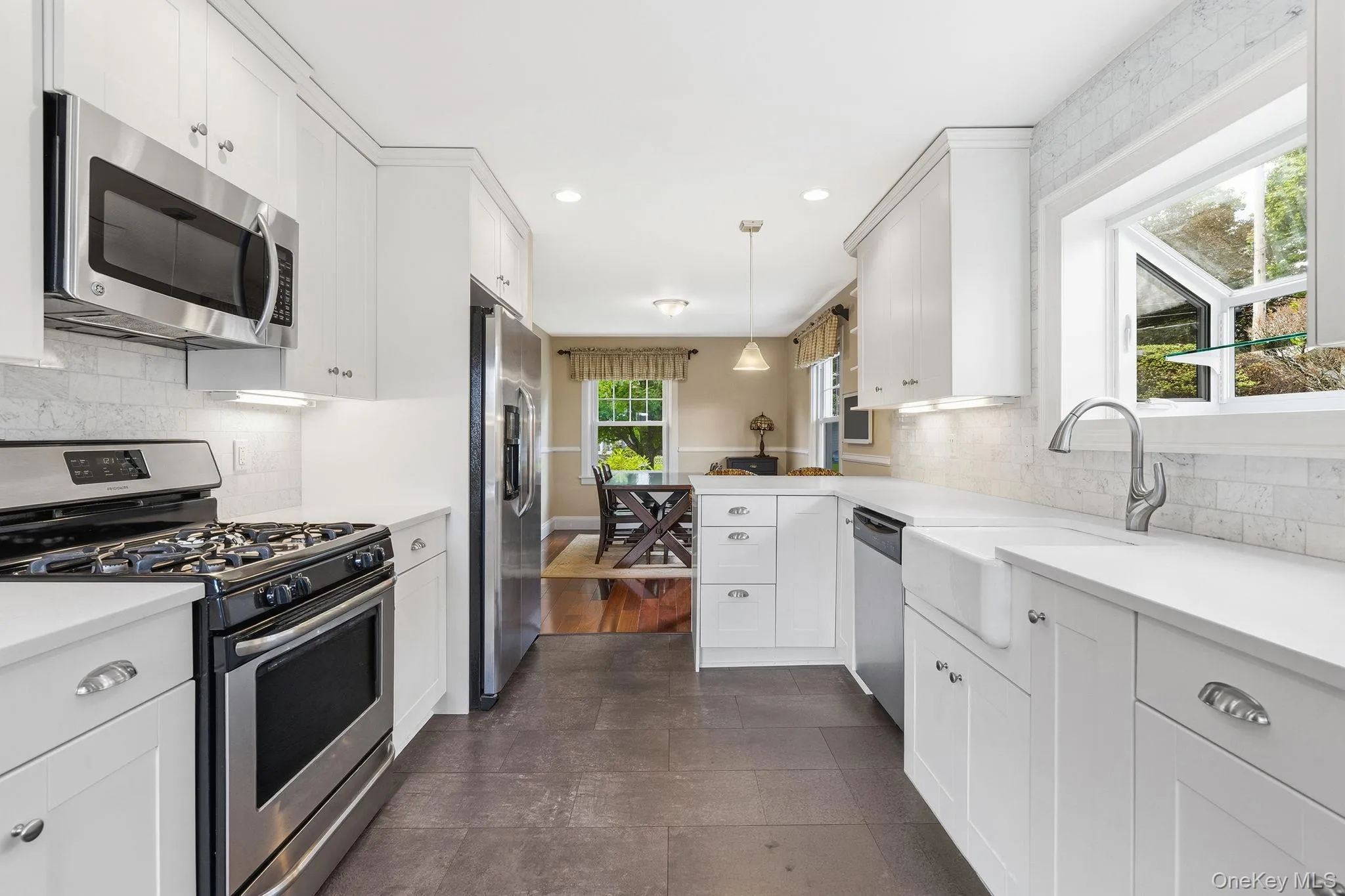 The marble backsplash creates a stunning backdrop that blends luxury and functionality. The marble backsplash creates a stunning backdrop that blends luxury and functionality.