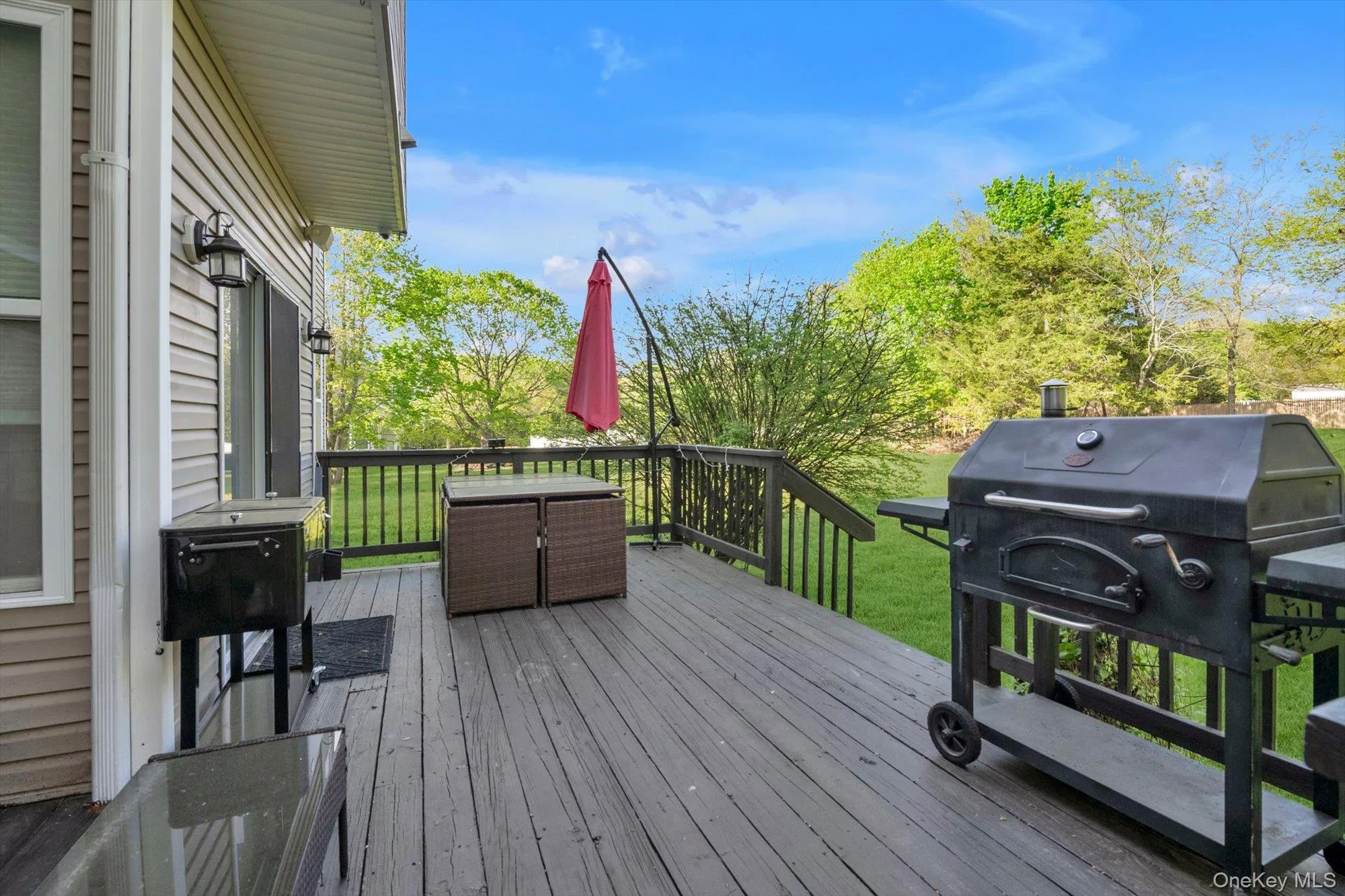Rear Deck off Kitchen Facing Endless Yard and Trees Rear Deck off Kitchen Facing Endless Yard and Trees