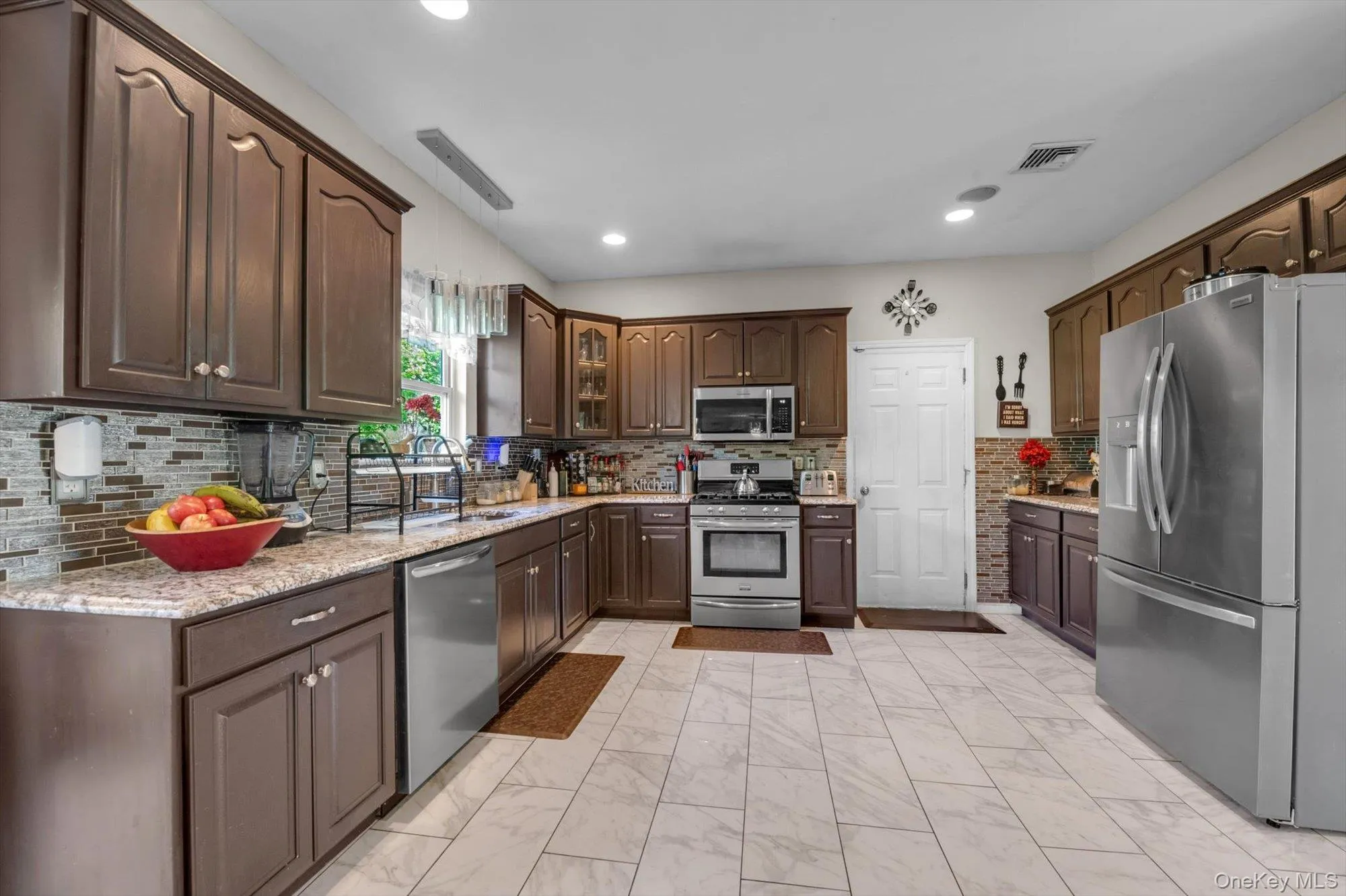 Updated Kitchen, New Tile Floors, Appliances, Countertops....2 Car Garage Entry Updated Kitchen, New Tile Floors, Appliances, Countertops....2 Car Garage Entry