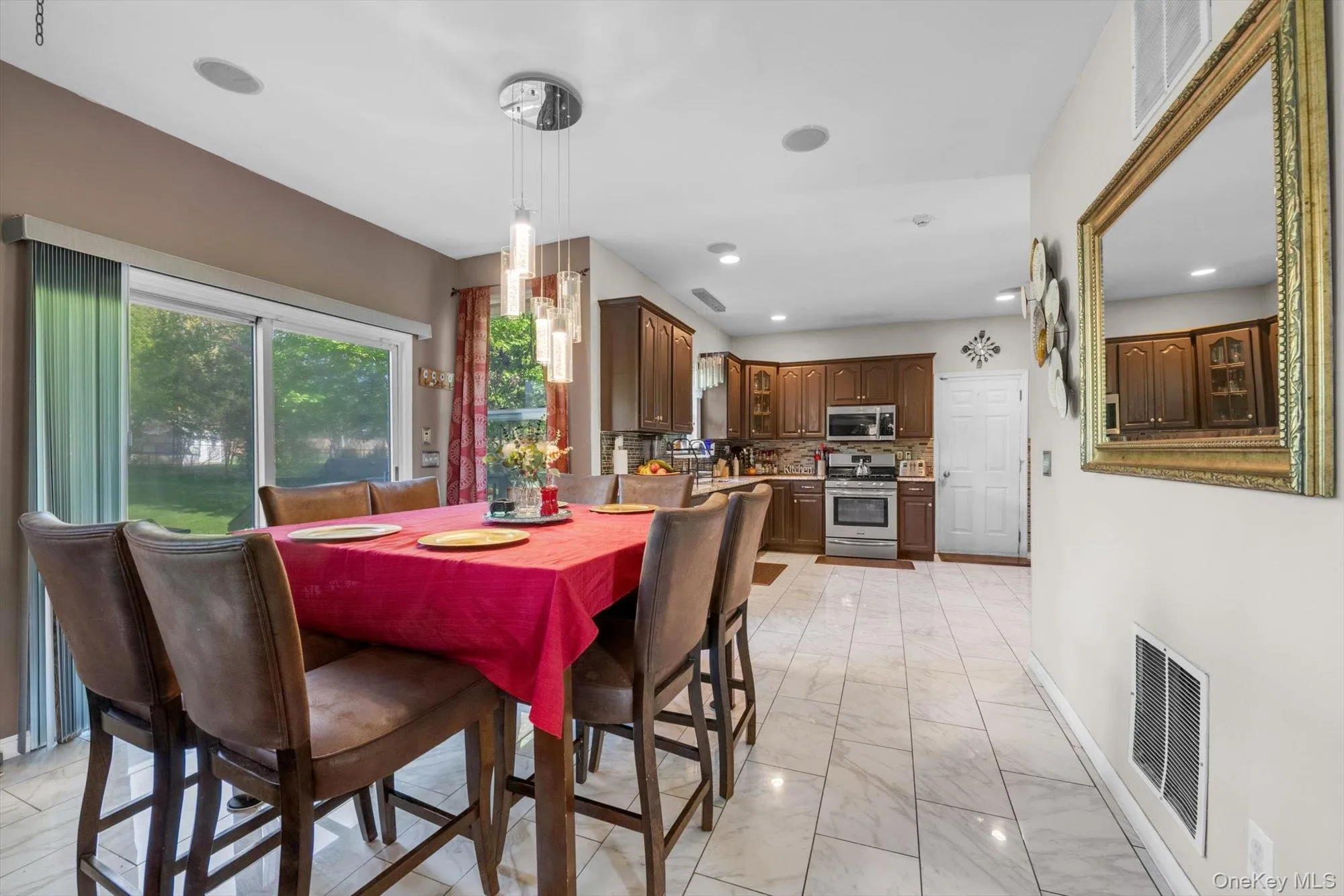 Eat-in-Kitchen Area with Sliding Glass Doors Leading to Plus Expansive Yard & Raised Terrace/ BBQ Porch Eat-in-Kitchen Area with Sliding Glass Doors Leading to Plus Expansive Yard & Raised Terrace/ BBQ Porch