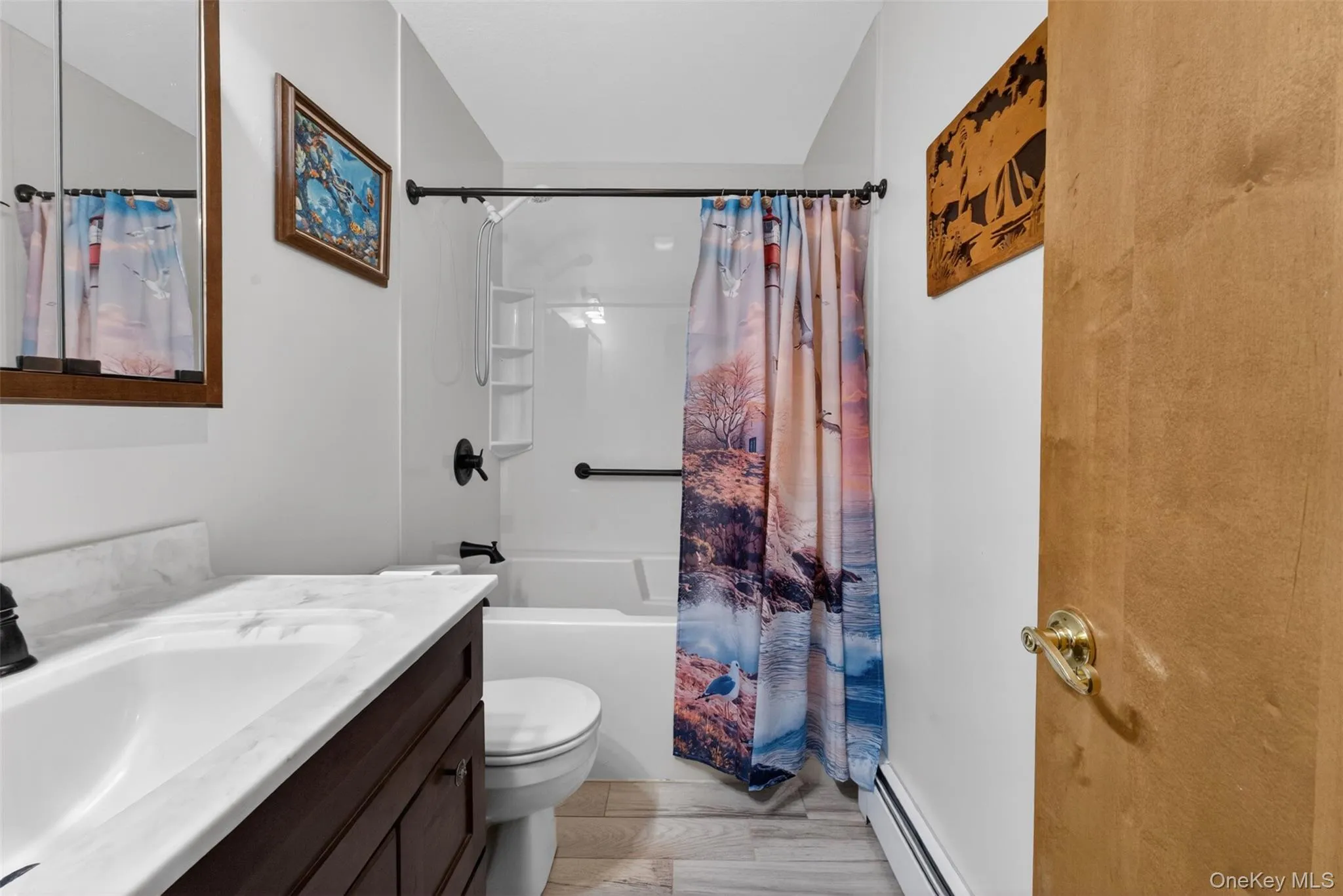 Bathroom featuring a dark wood-finish vanity with a white countertop and integrated sink, a white toilet, and a white soaker tub with a shower surround Bathroom featuring a dark wood-finish vanity with a white countertop and integrated sink, a white toilet, and a white soaker tub with a shower surround