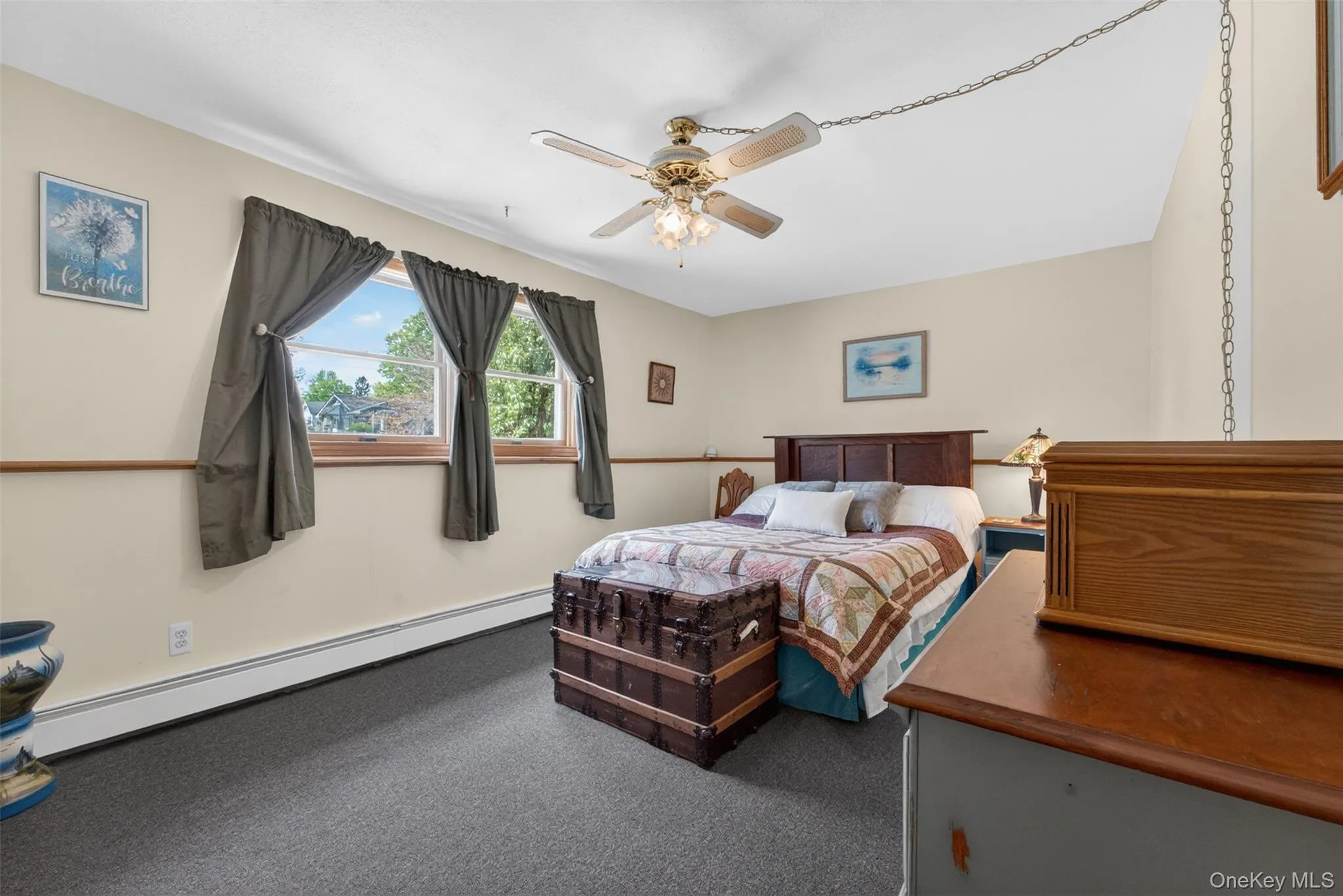 Room featuring two windows, wall-to-wall carpeting, and a ceiling fan with integrated lighting Room featuring two windows, wall-to-wall carpeting, and a ceiling fan with integrated lighting