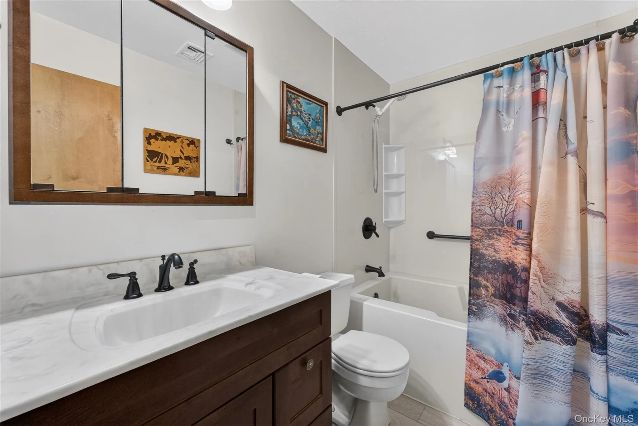 Bathroom featuring a dark wood-finish vanity with a white countertop and integrated sink, matte black faucet, and a medicine cabinet with a wood-finish frame, and soaker tub Bathroom featuring a dark wood-finish vanity with a white countertop and integrated sink, matte black faucet, and a medicine cabinet with a wood-finish frame, and soaker tub